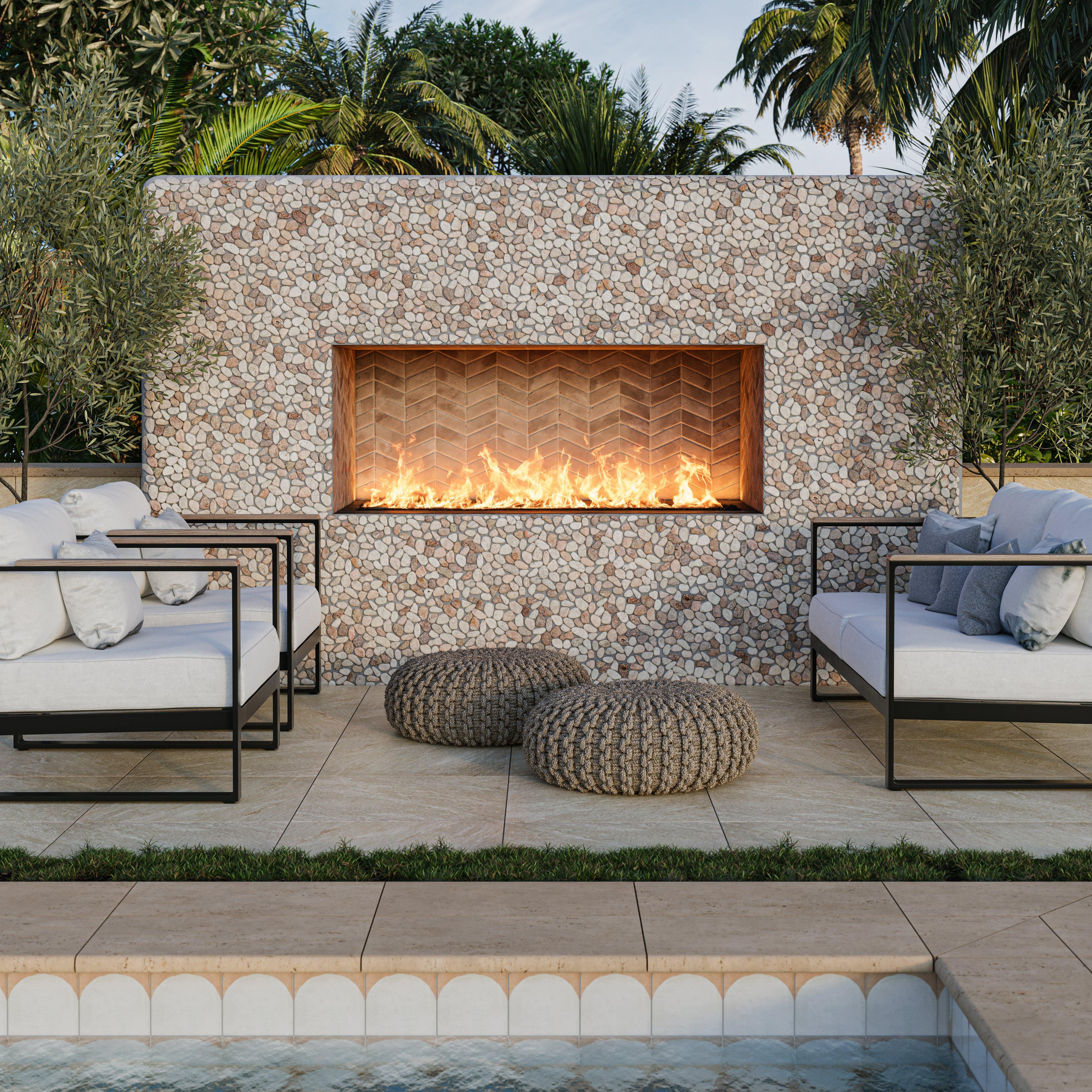 Outdoor seating area with beige pebble mosaic fireplace.