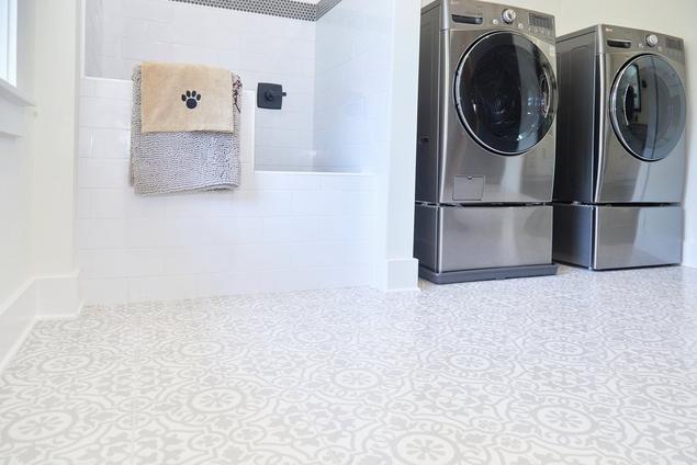 Laundry and pet washroom with white pattern look flooring tile and white subway tile dogbath.