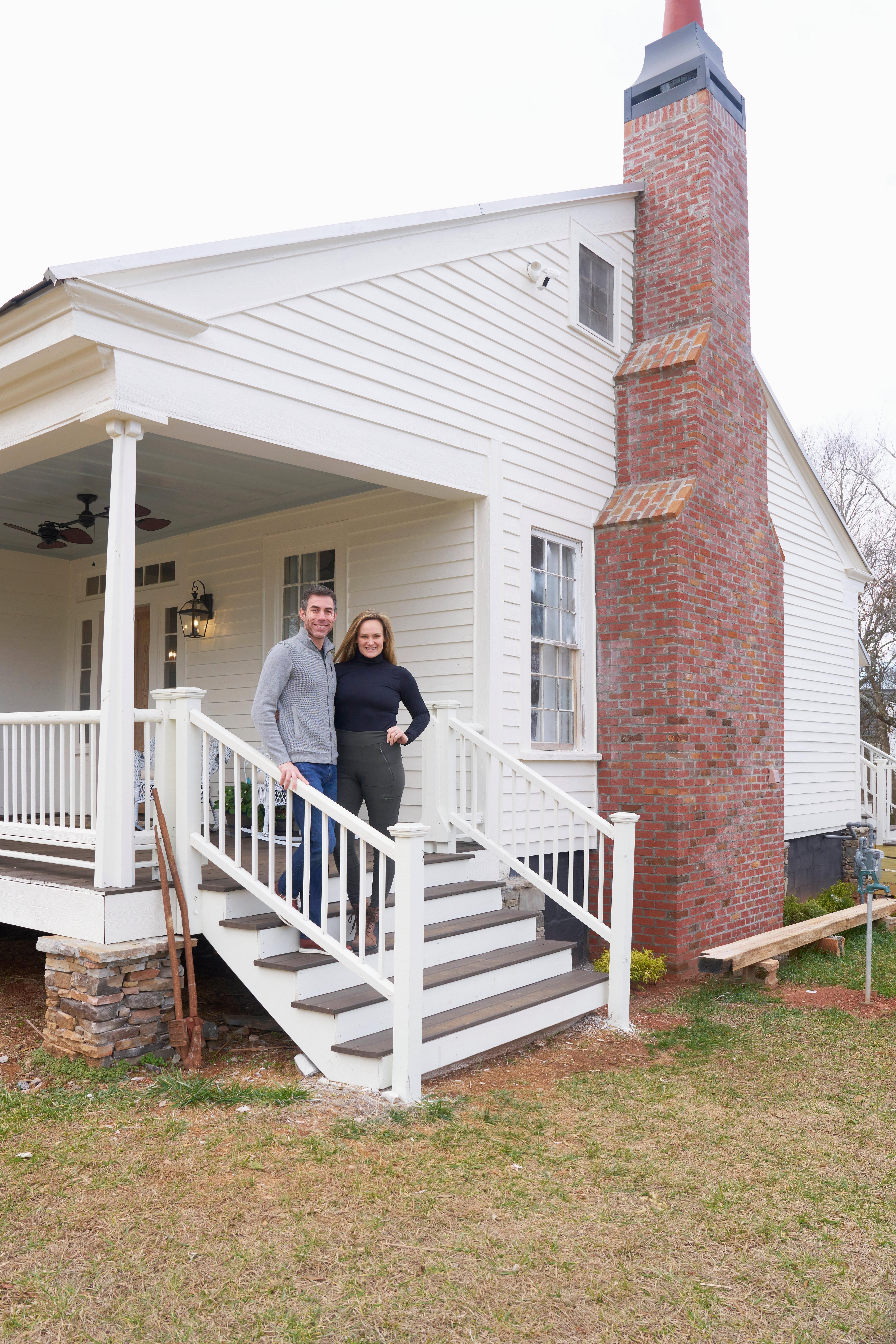 portrait of couple on steps of historic house
