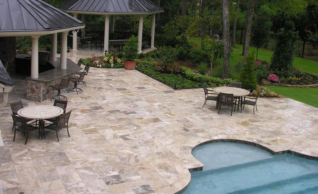 Storm polished Travertine tile used as pool deck.