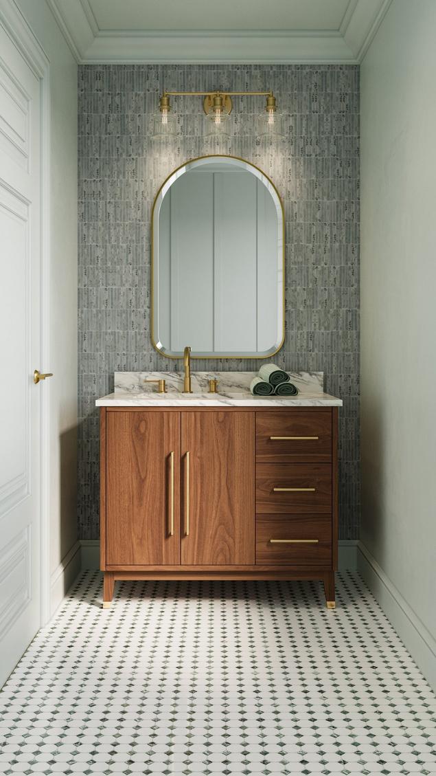 Bathroom with green marble accent wall and white and green marble mosaic floors.