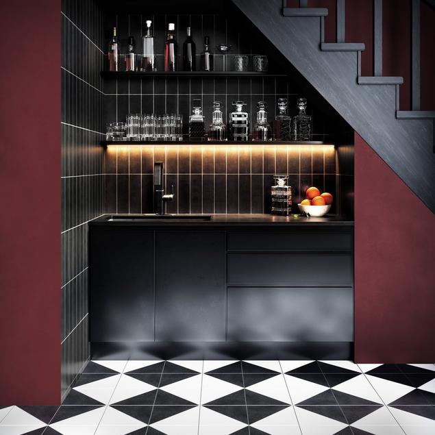 Burgundy basement wet bar with black cabinets, checkerboard floor, and black tile backsplash.