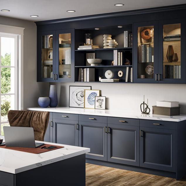 White home office with blue beveled shaker cabinets.