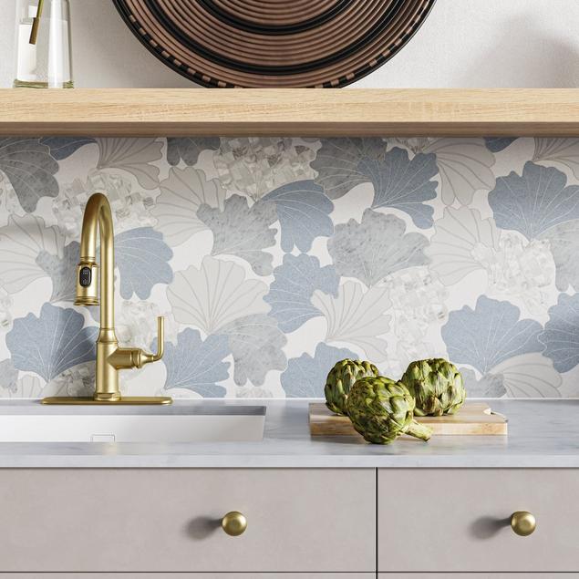 Kitchen with blue, white, and gray botanical backsplash.