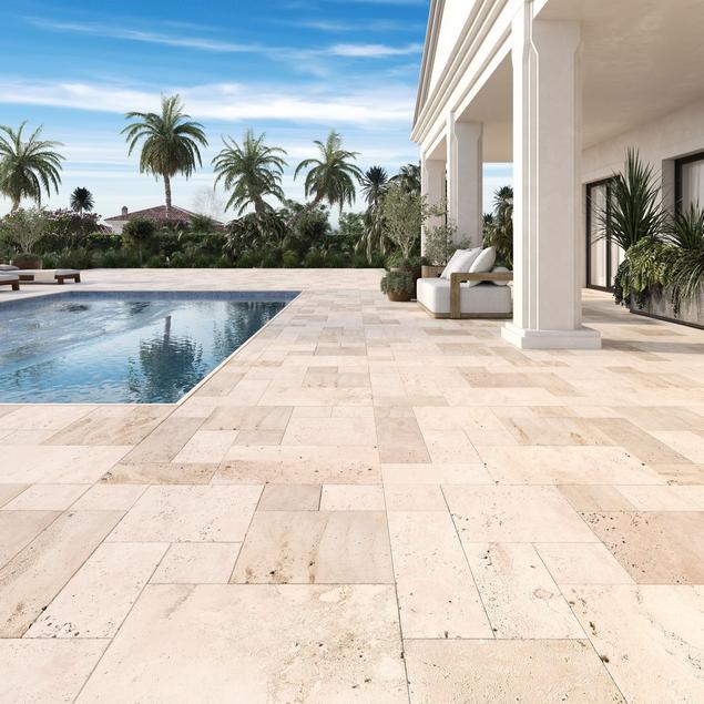 A patio with a pool in the corner