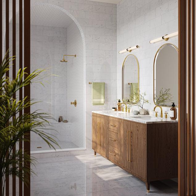 Bathroom with floor-to-ceiling white marble and a double medium brown wood vanity.