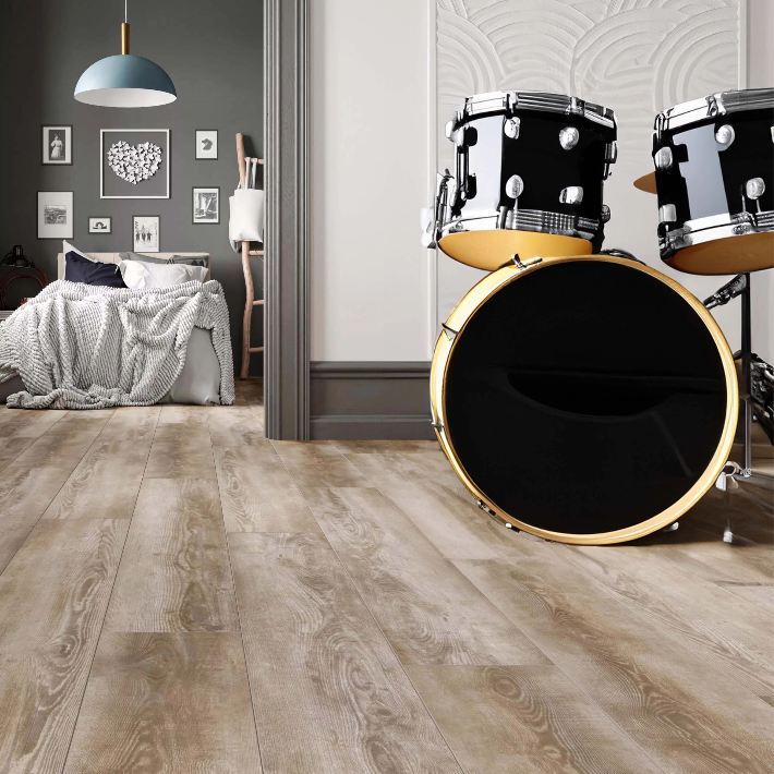 Room scene of a drum set outside of a bedroom