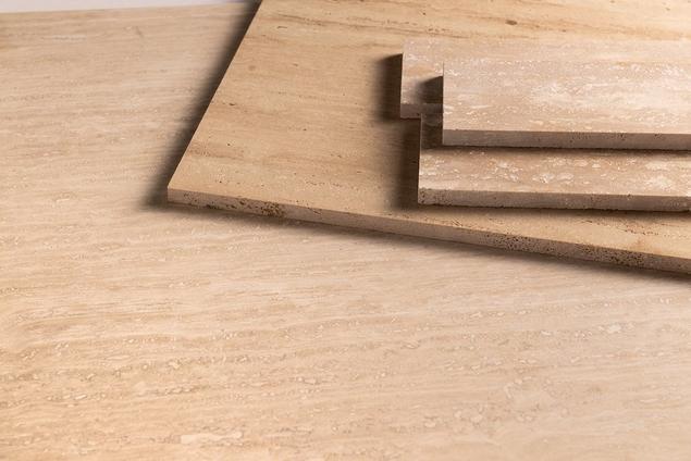 Close-up of travertine tile samples.