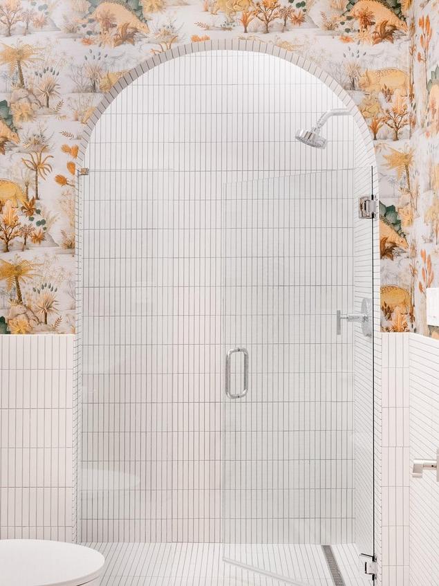 A contemporary shower featuring a clean, white stack porcelain mosaic tile.