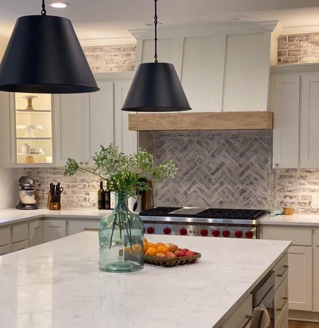 A brick backsplash in a kitchen