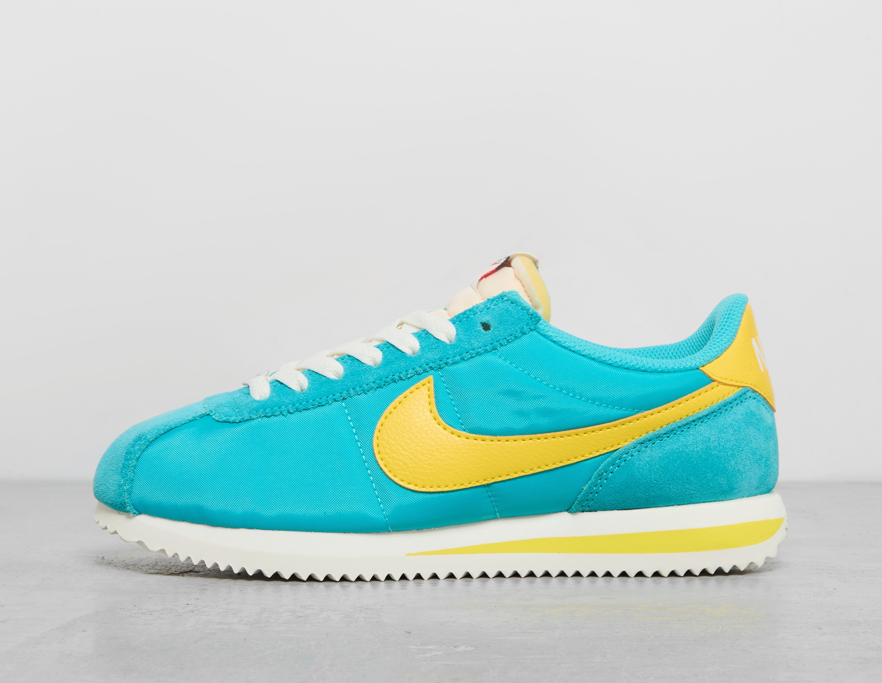 Nike cortez yellow blue best sale