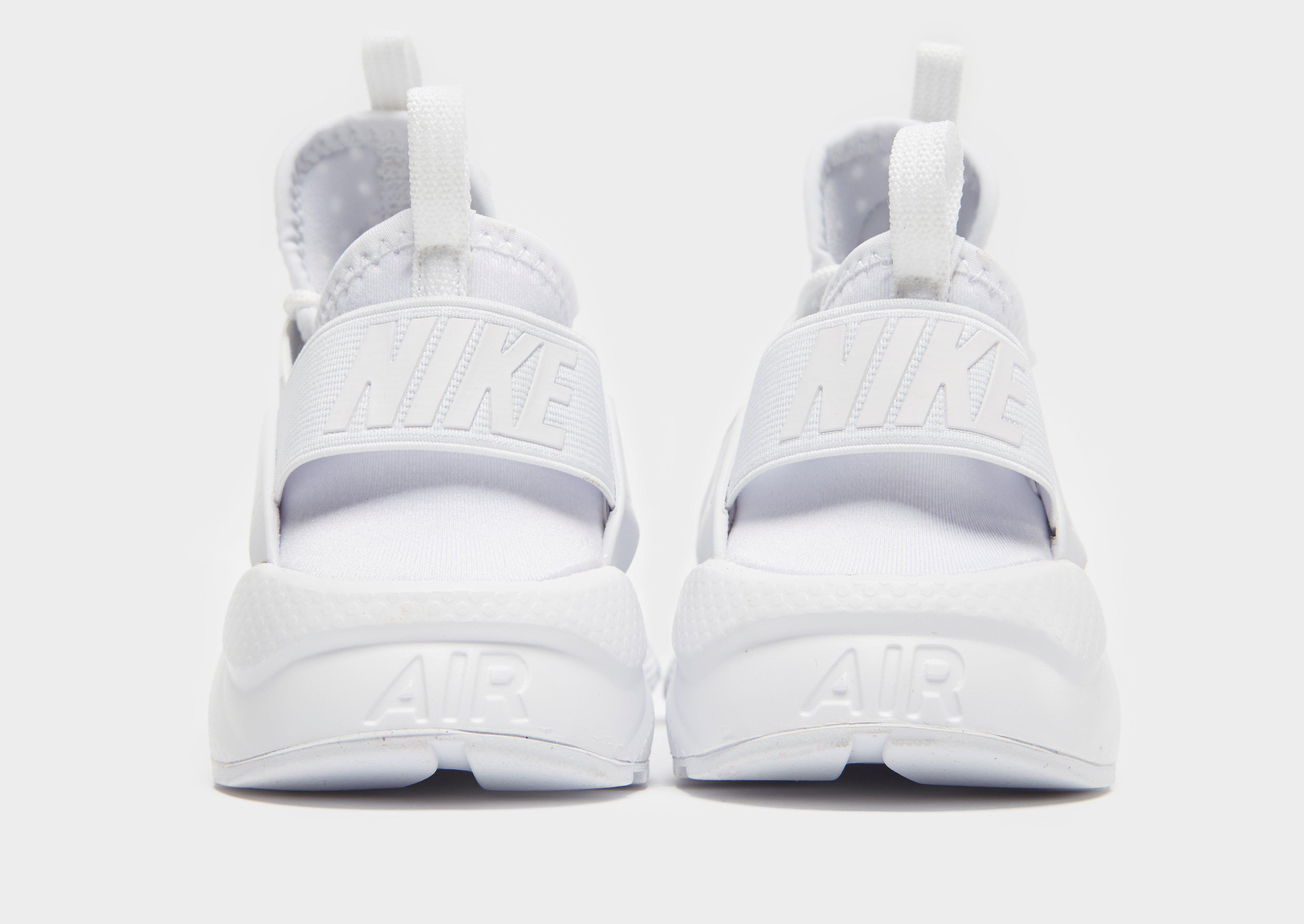 black and white huaraches junior