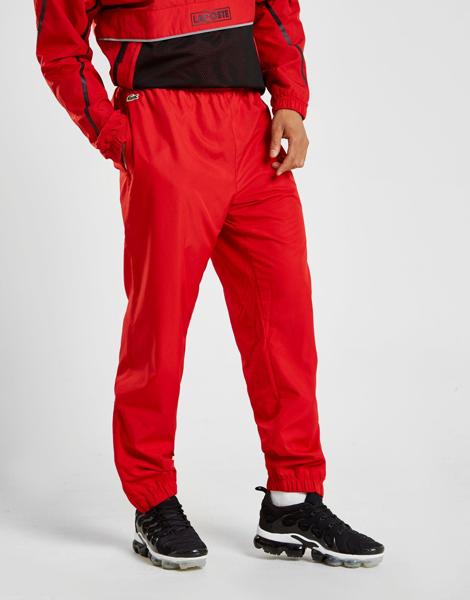 red lacoste track pants