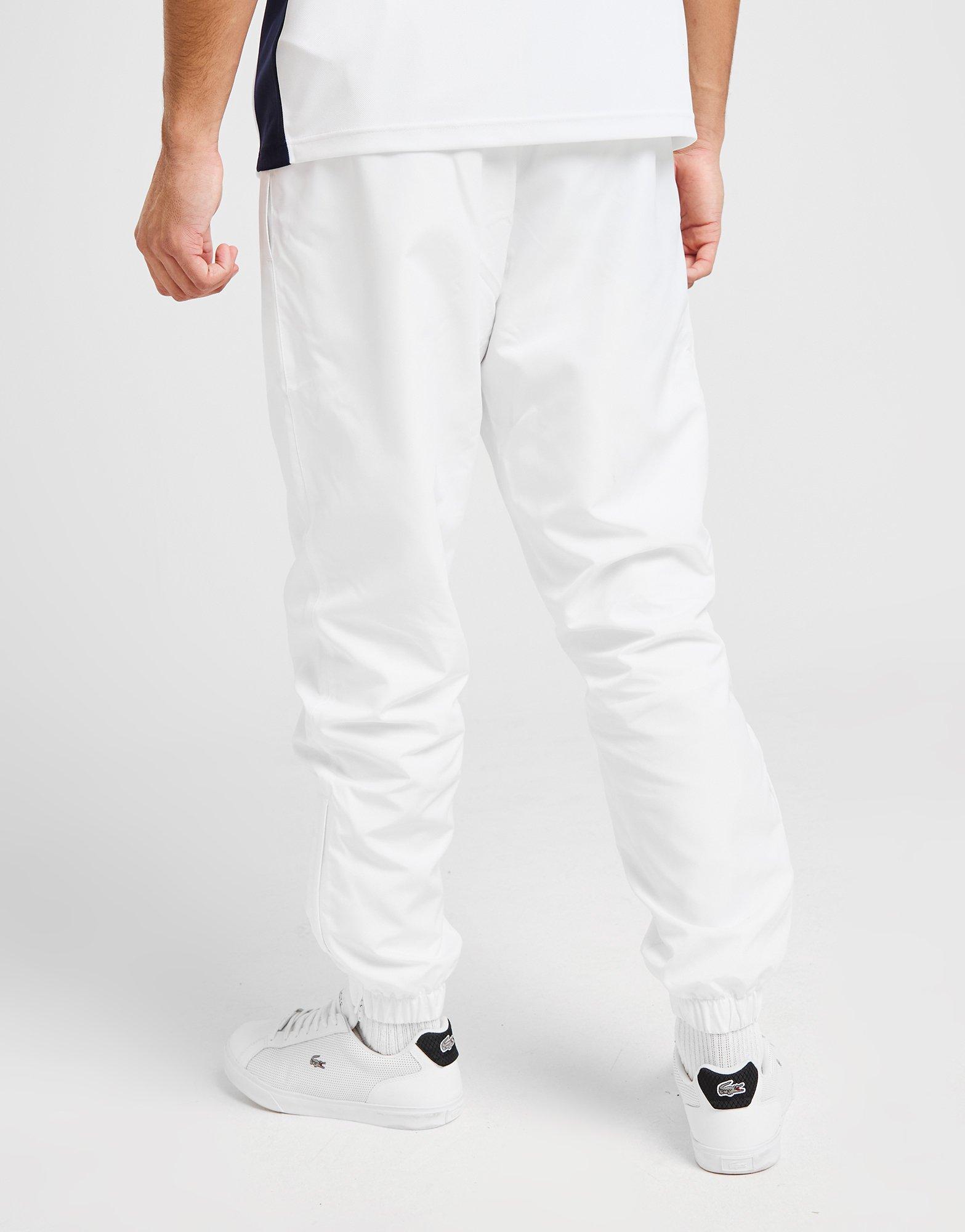 grey lacoste guppy track pants