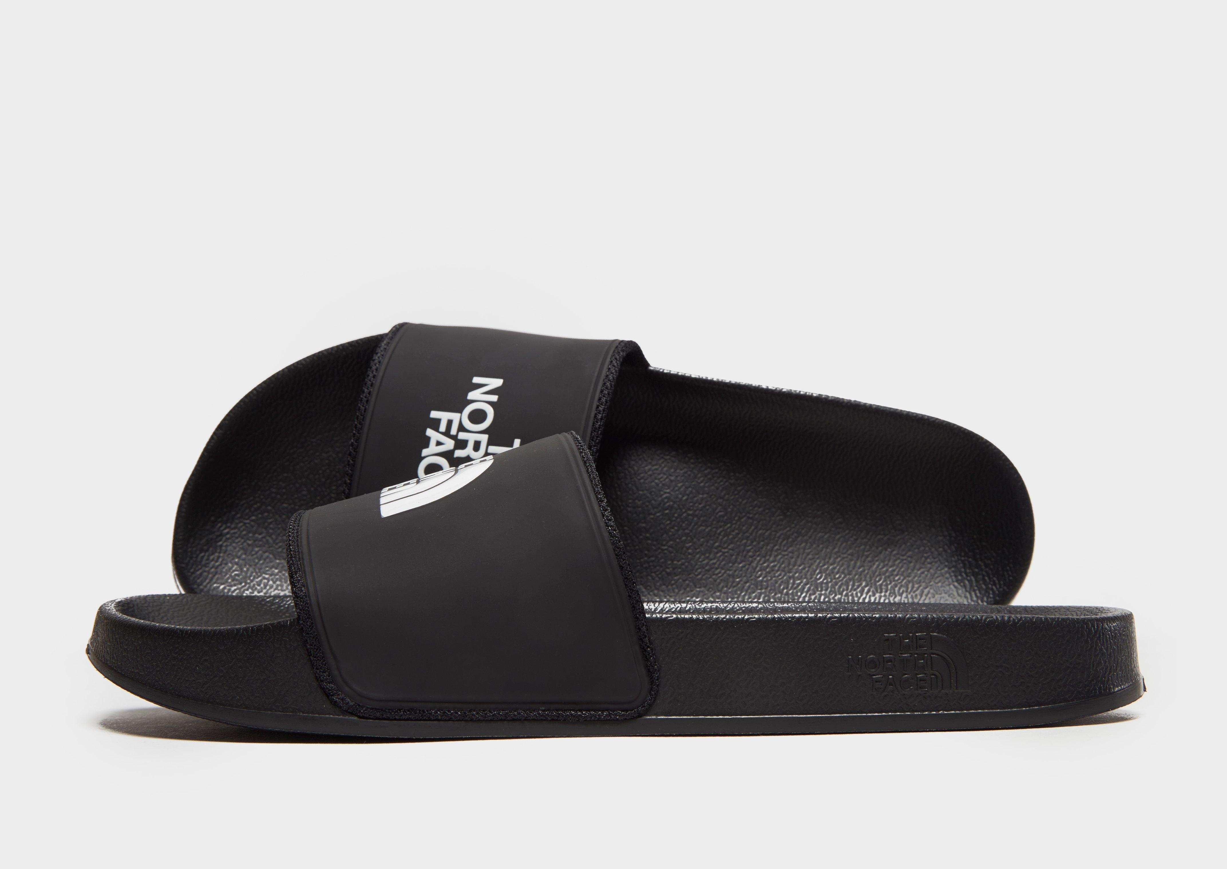 black north face sliders
