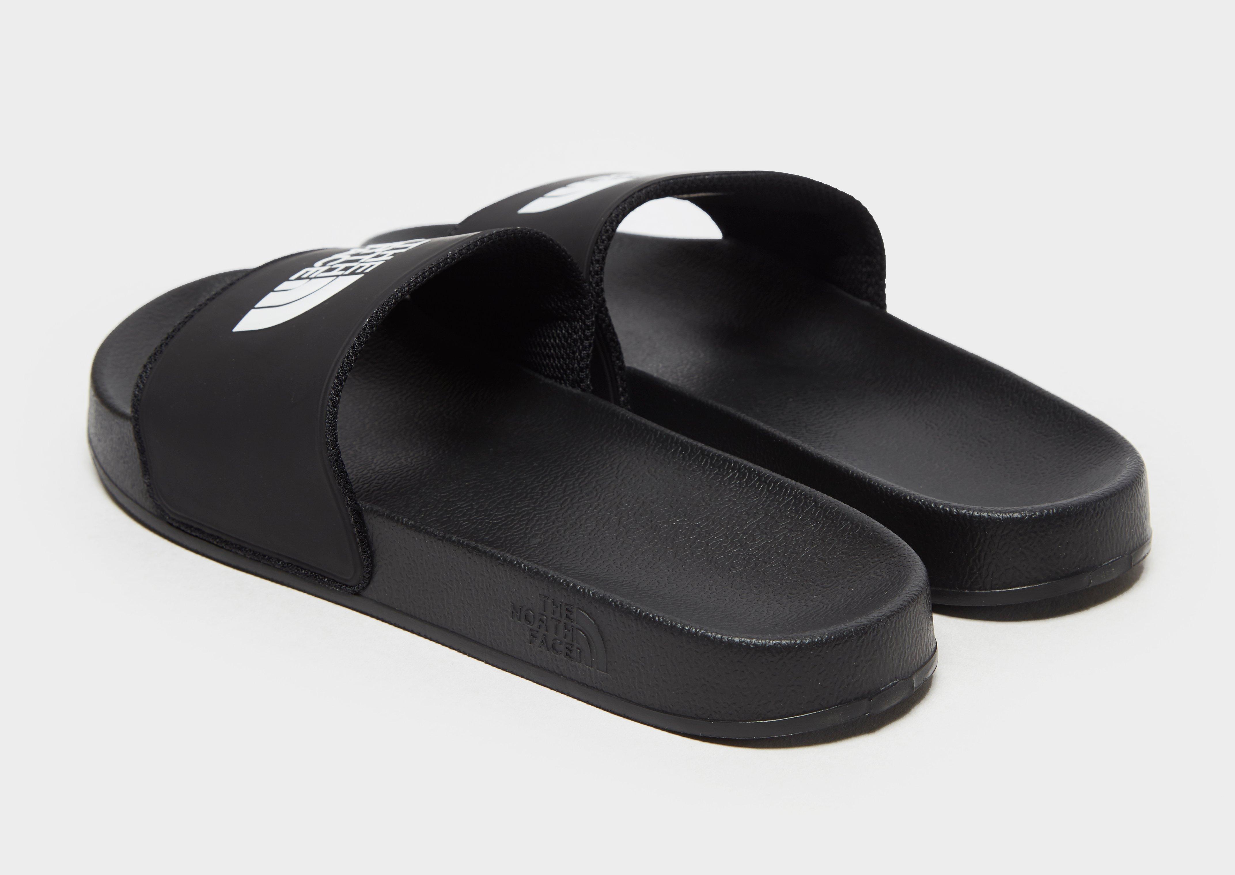black north face sliders