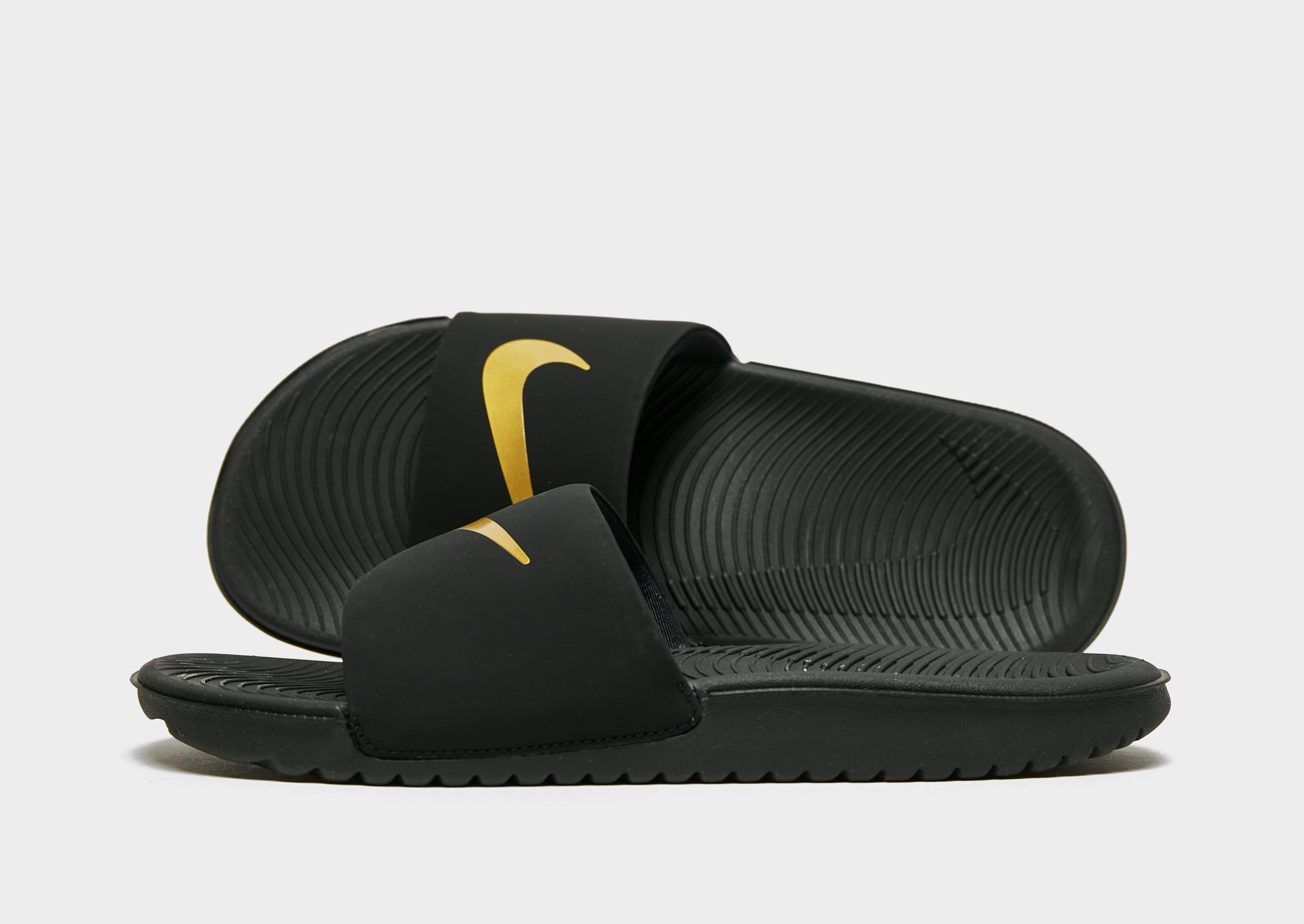 nike kawa black and gold sliders