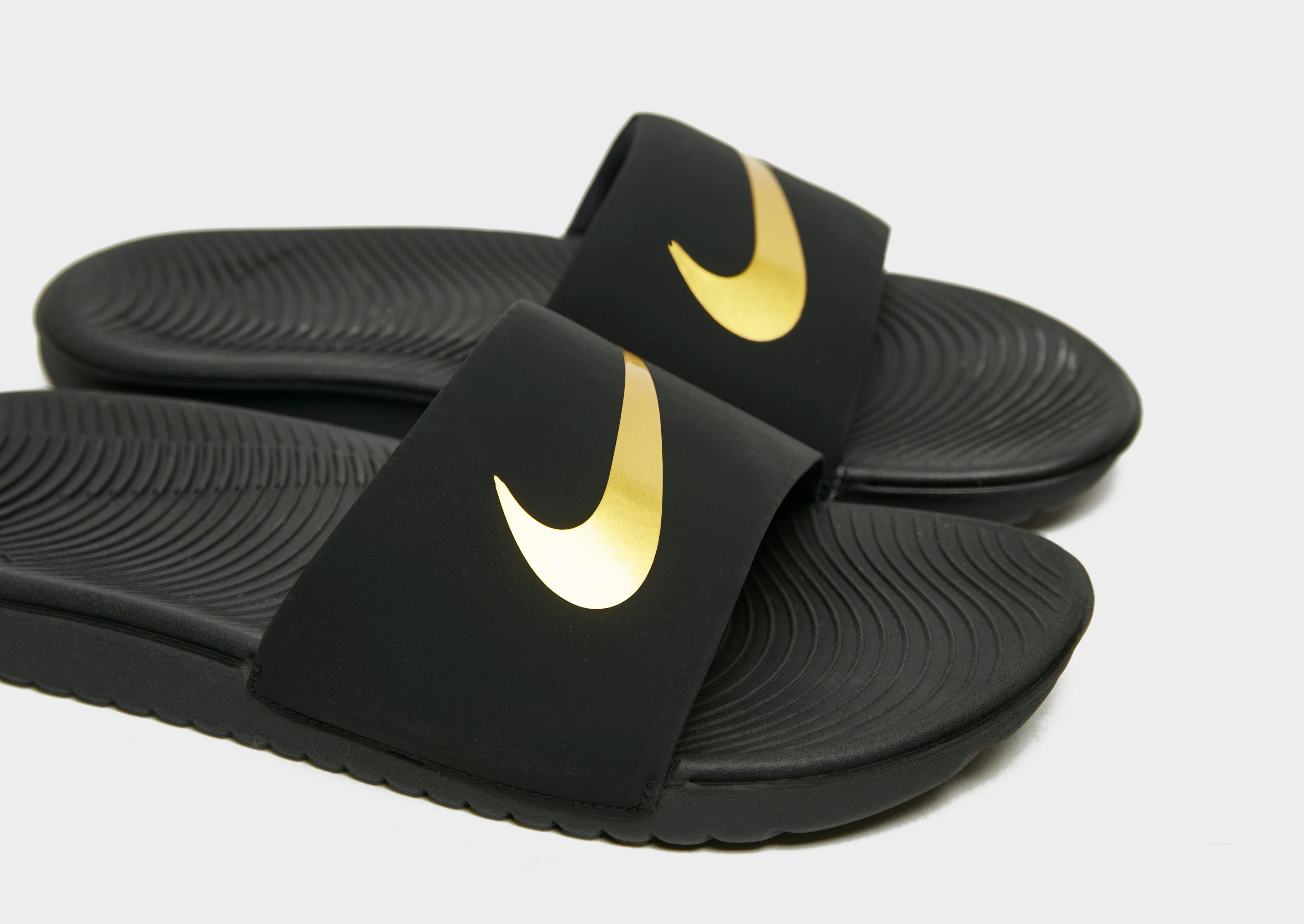 Black nike slides with gold swoosh hotsell