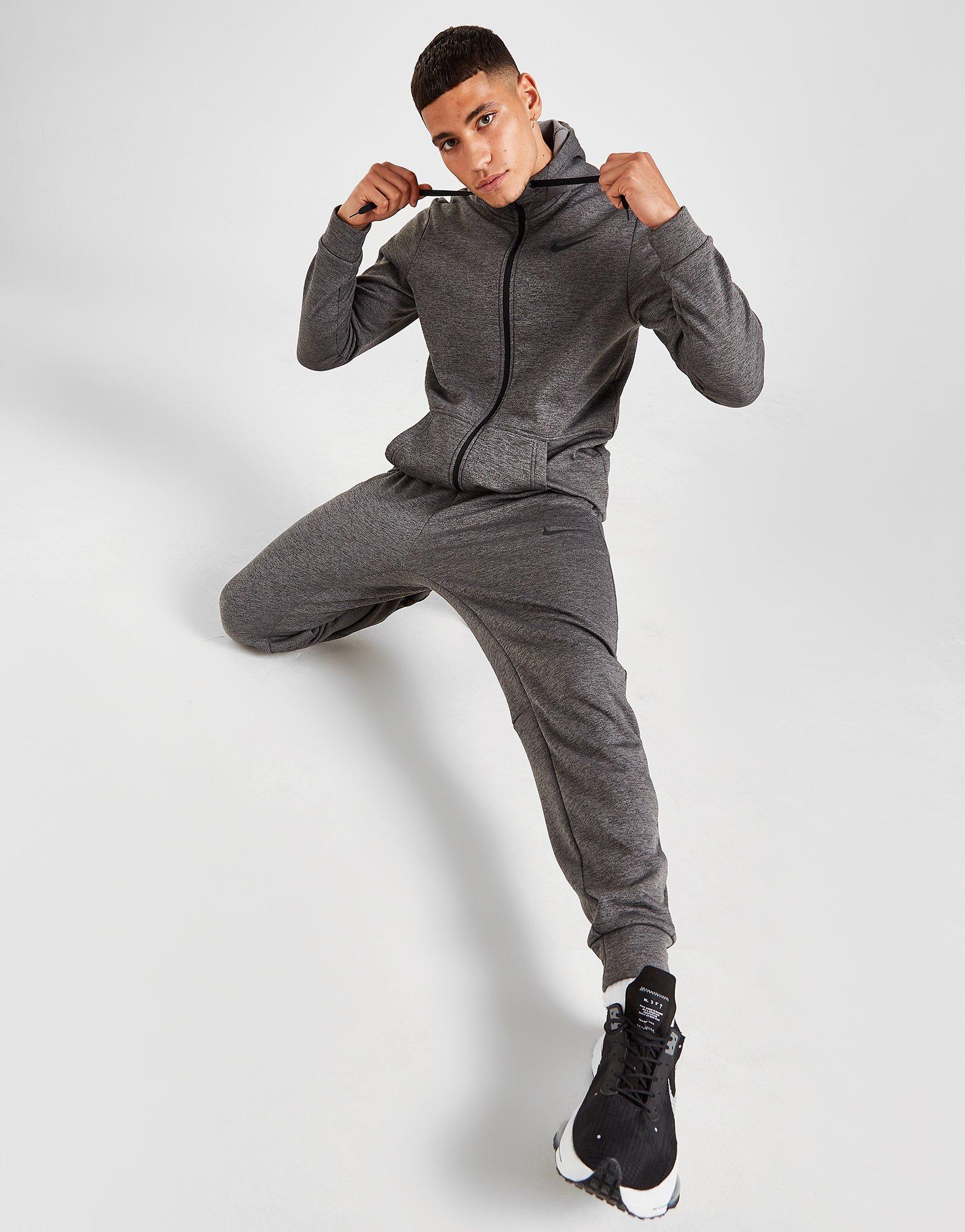 nike therma track pants mens