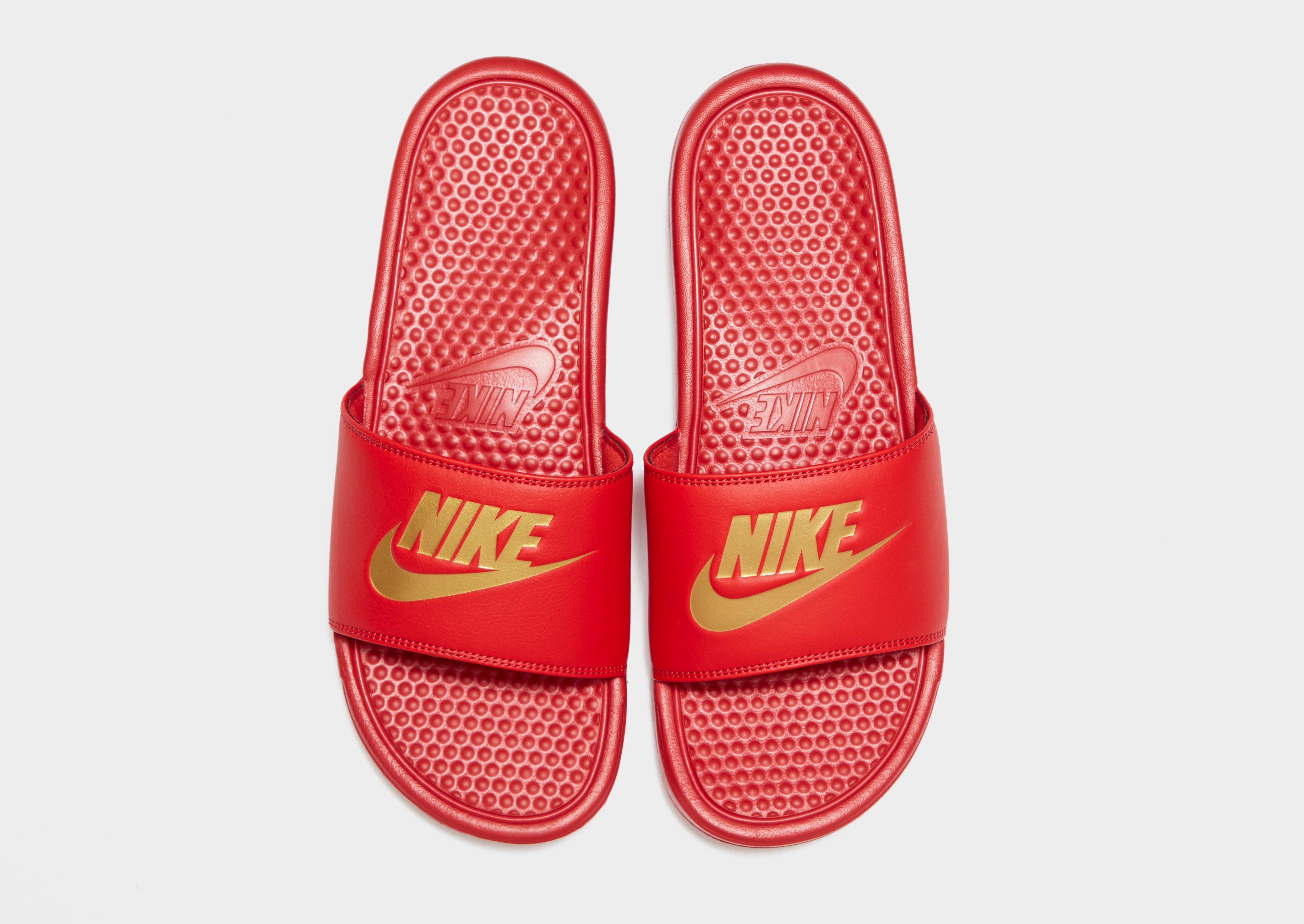 orange nike benassi slides