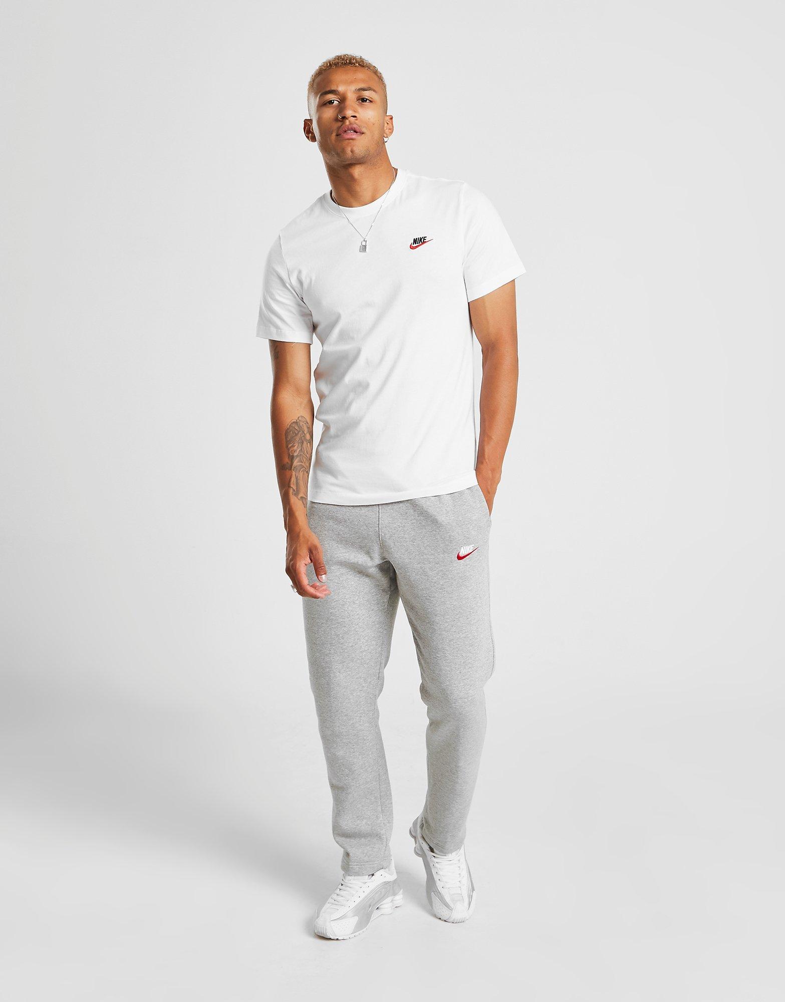 white nike top with red tick
