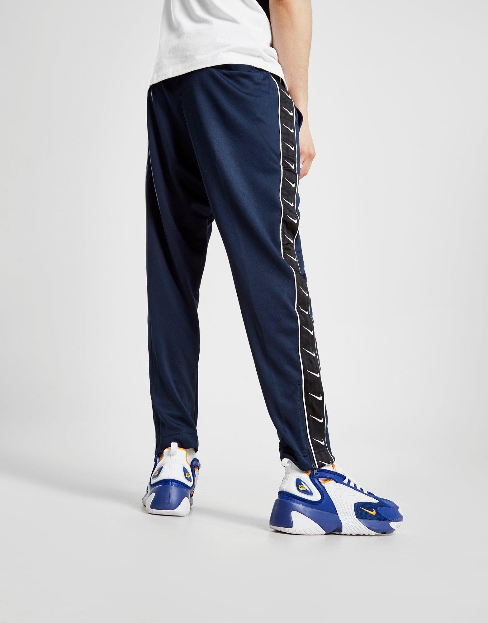 navy blue nike track pants