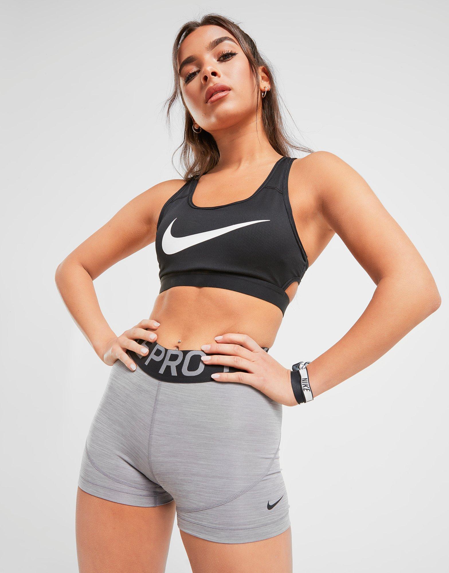 a girl wearing nike shorts