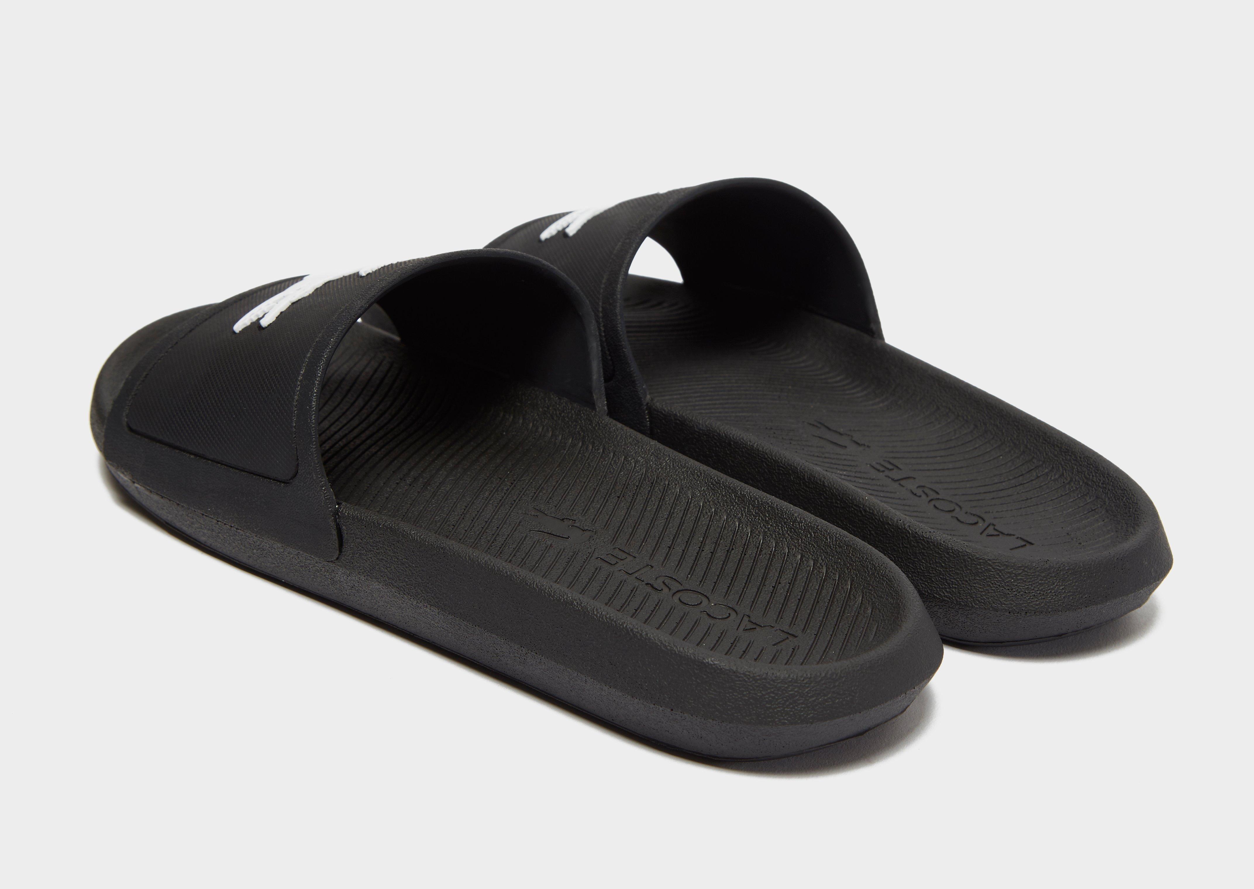 all black lacoste slides