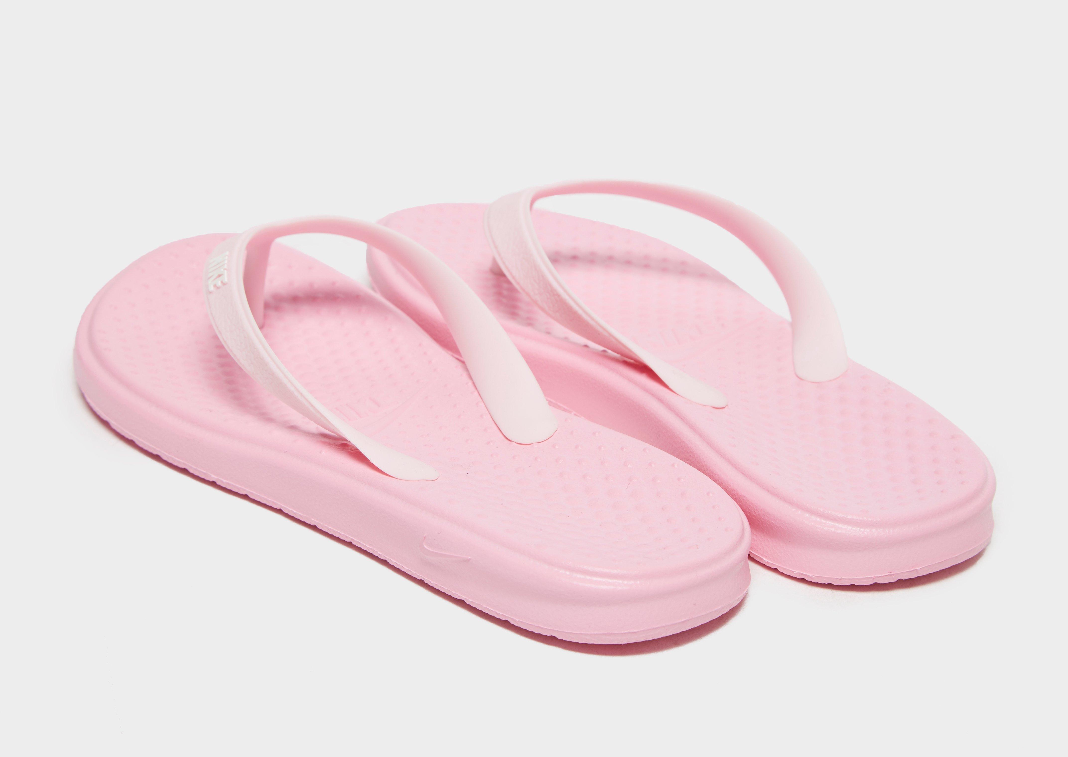 pink nike flip flops