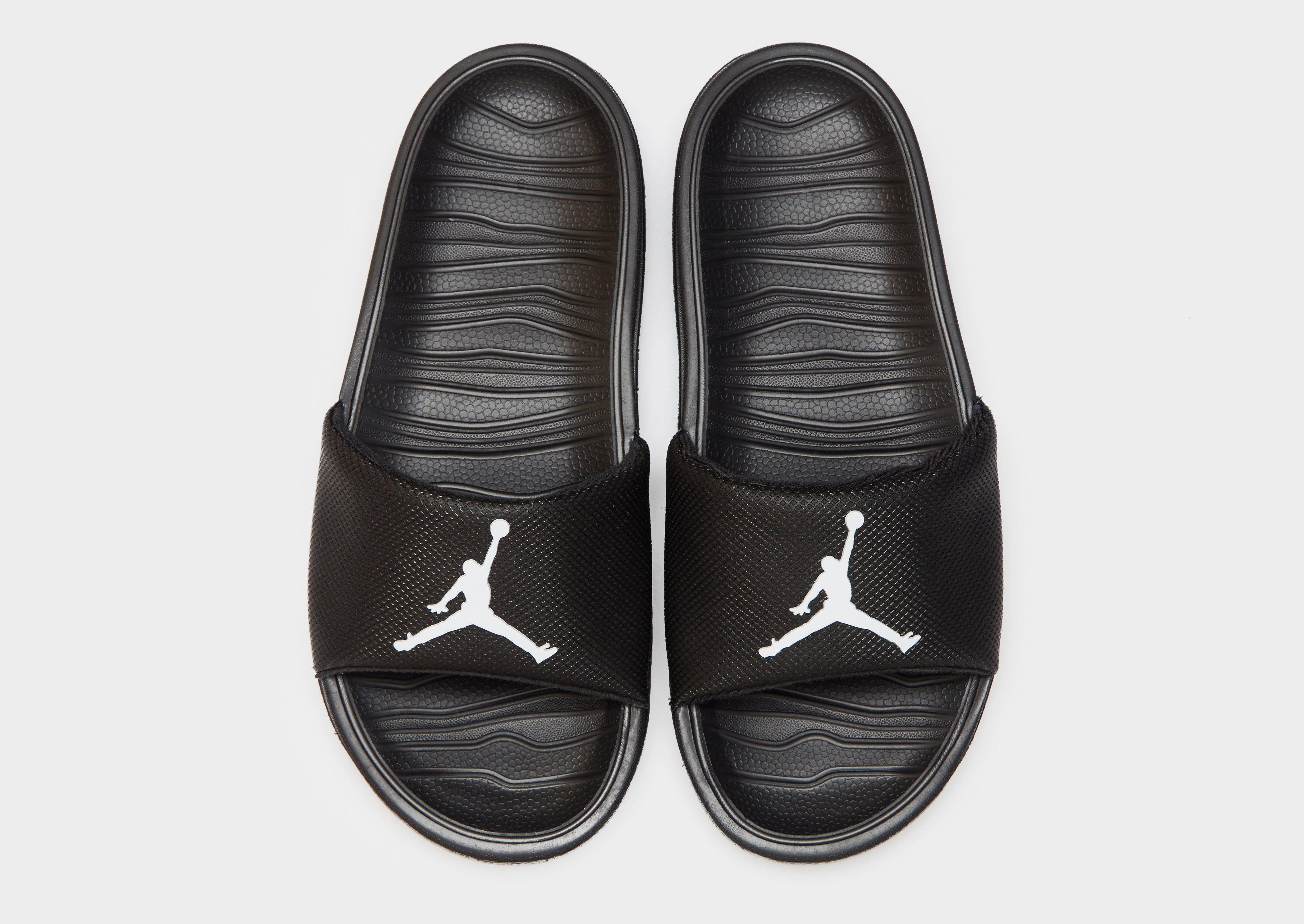 all black jordan slides