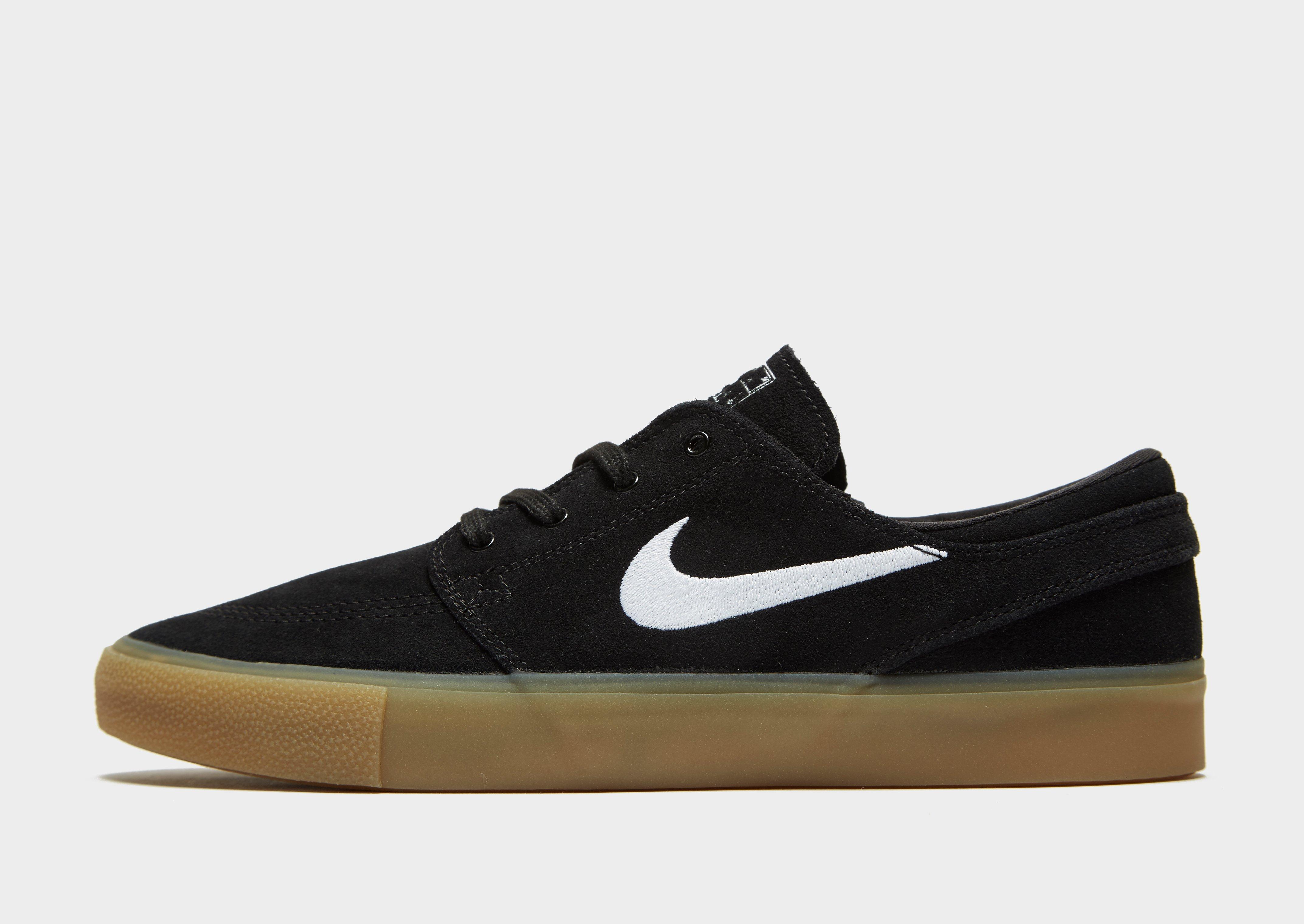 nike sb zoom janoski trainers in black with gum sole