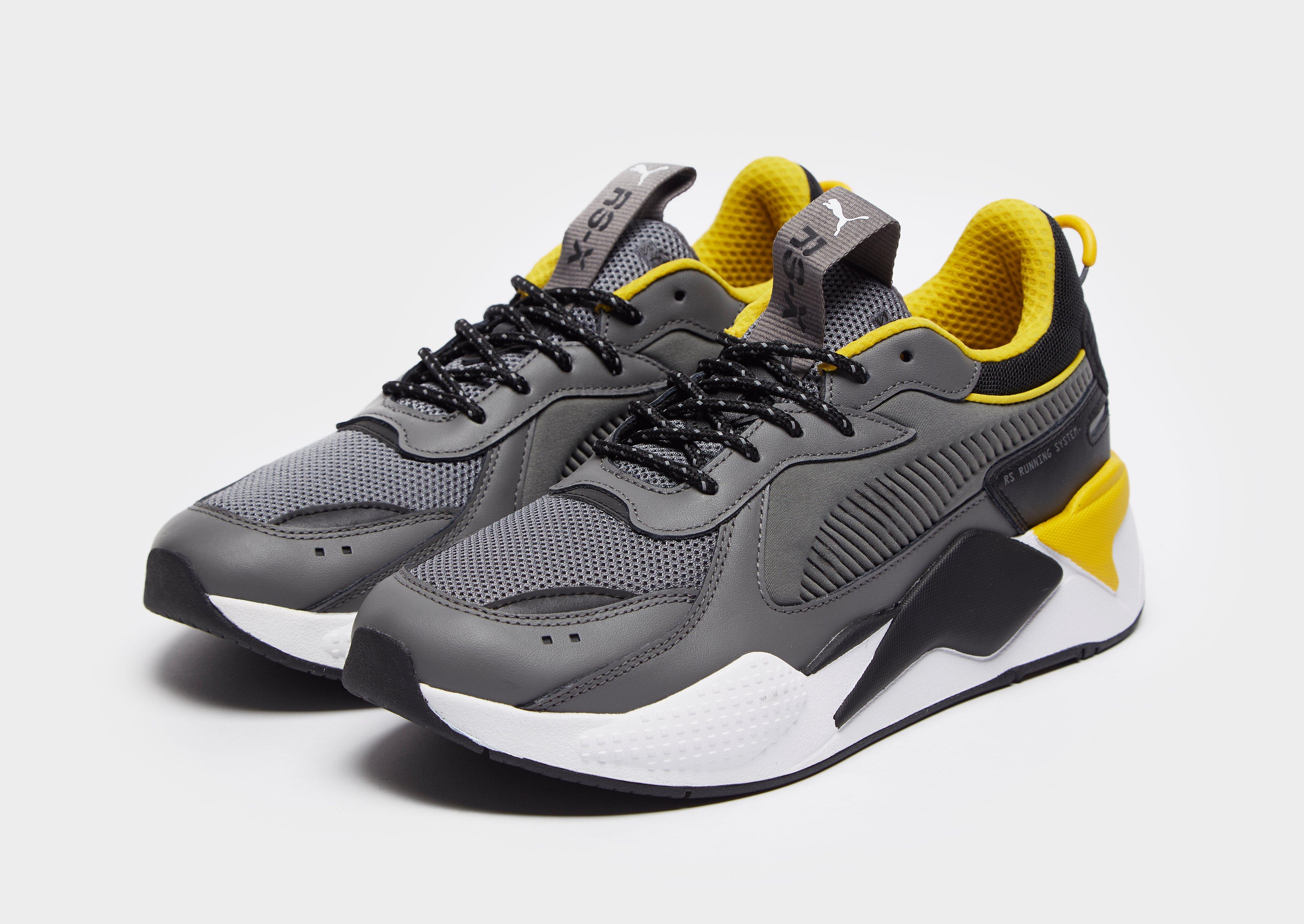 grey and yellow puma shoes