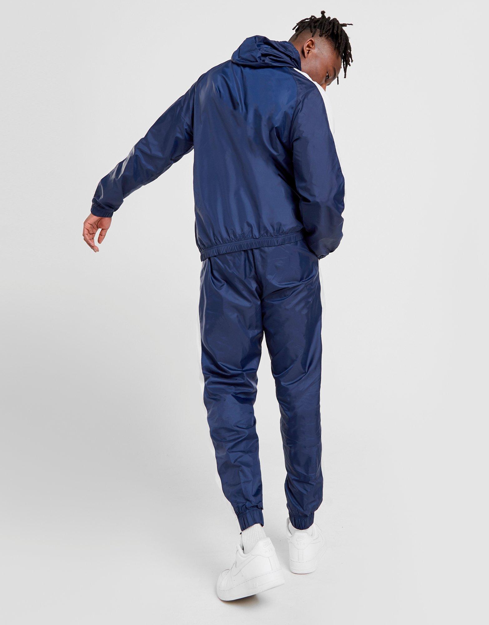 nike woven tracksuit blue