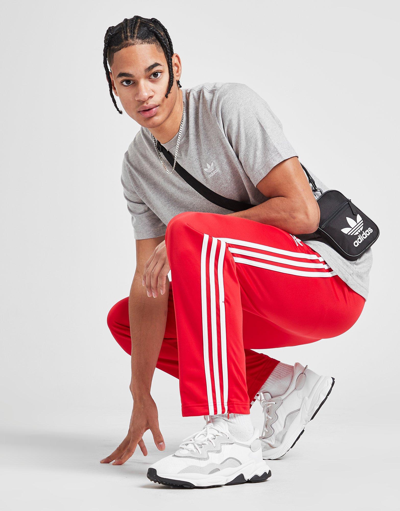 adidas firebird track pants red