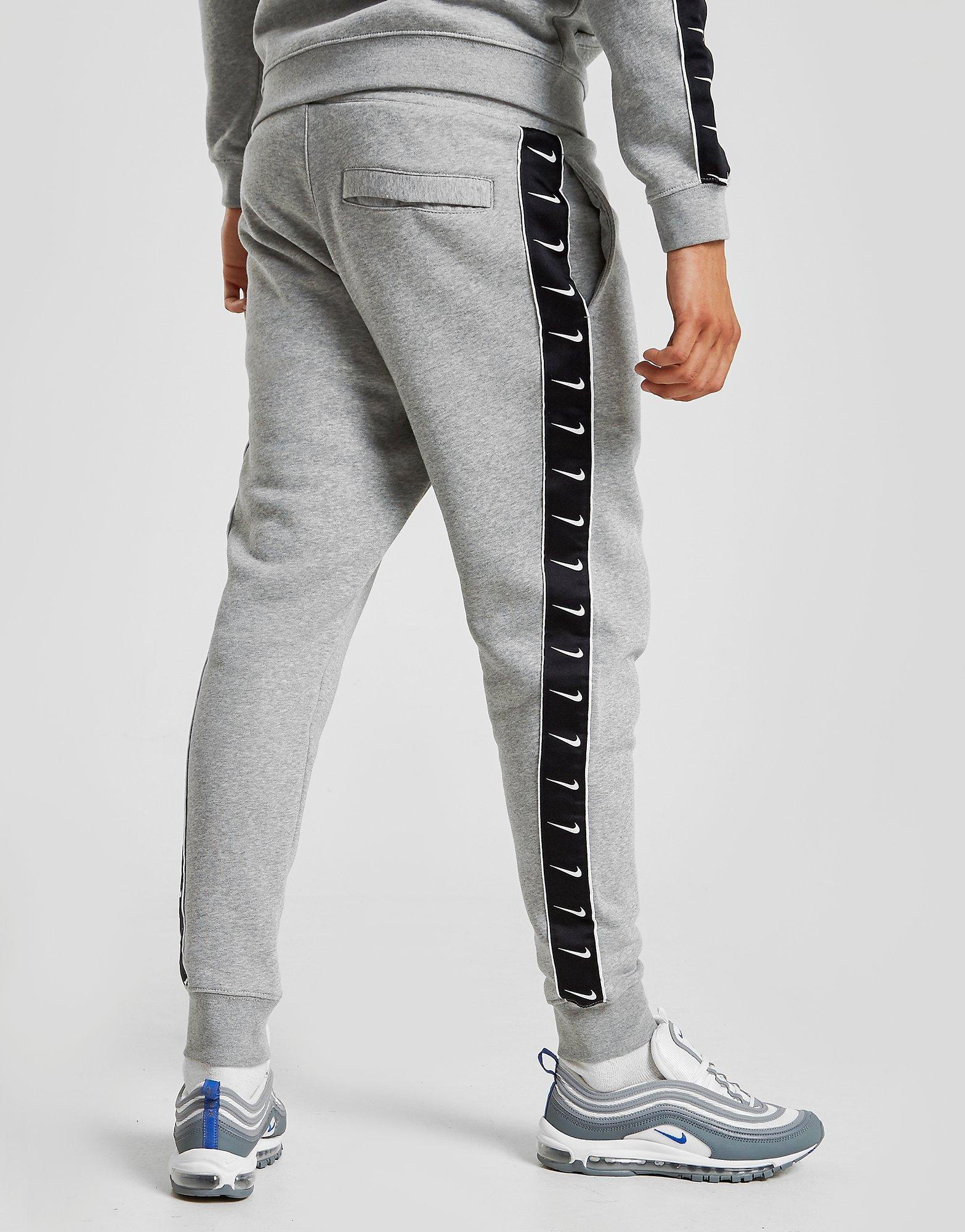 grey nike taped tracksuit