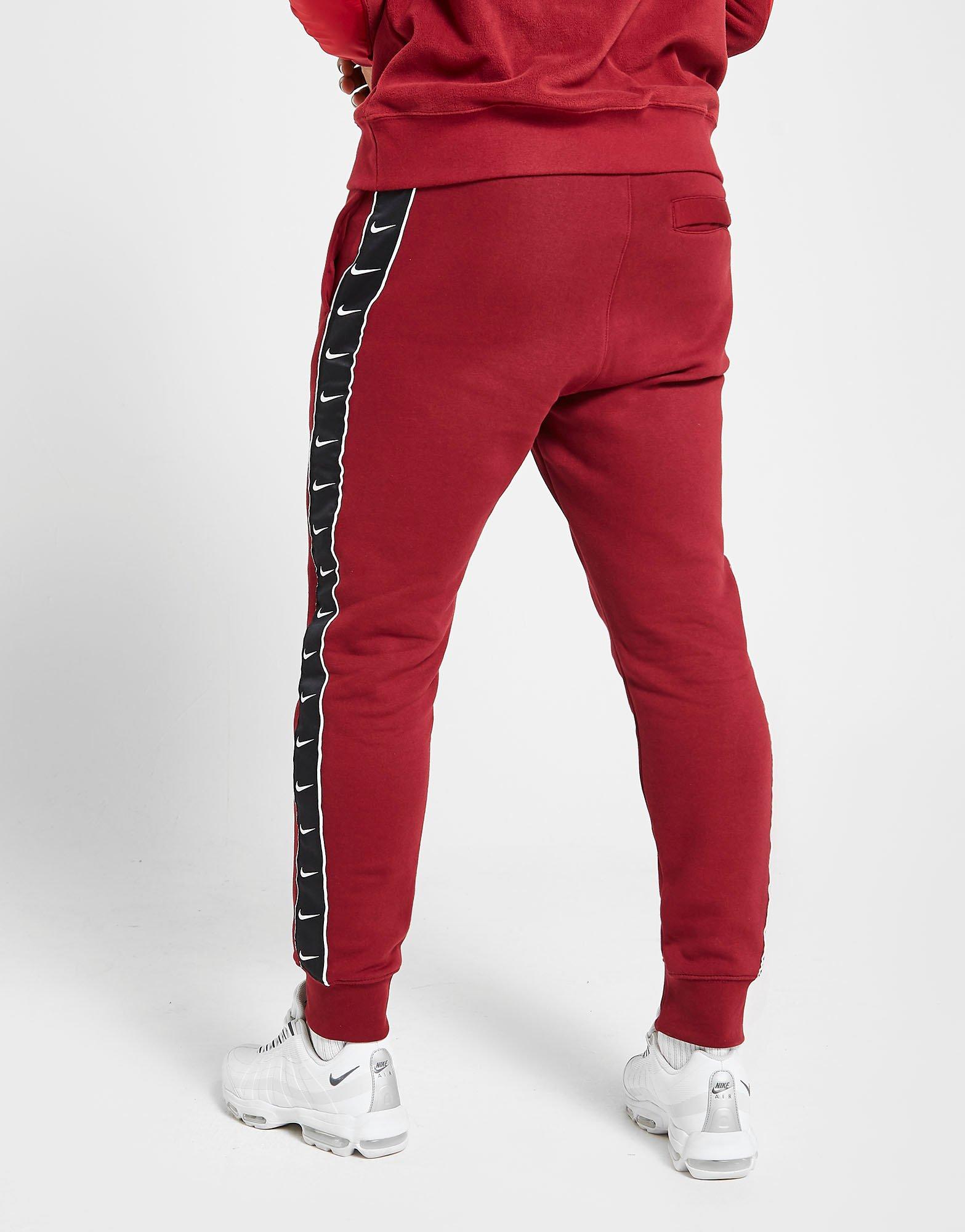 red nike tape joggers