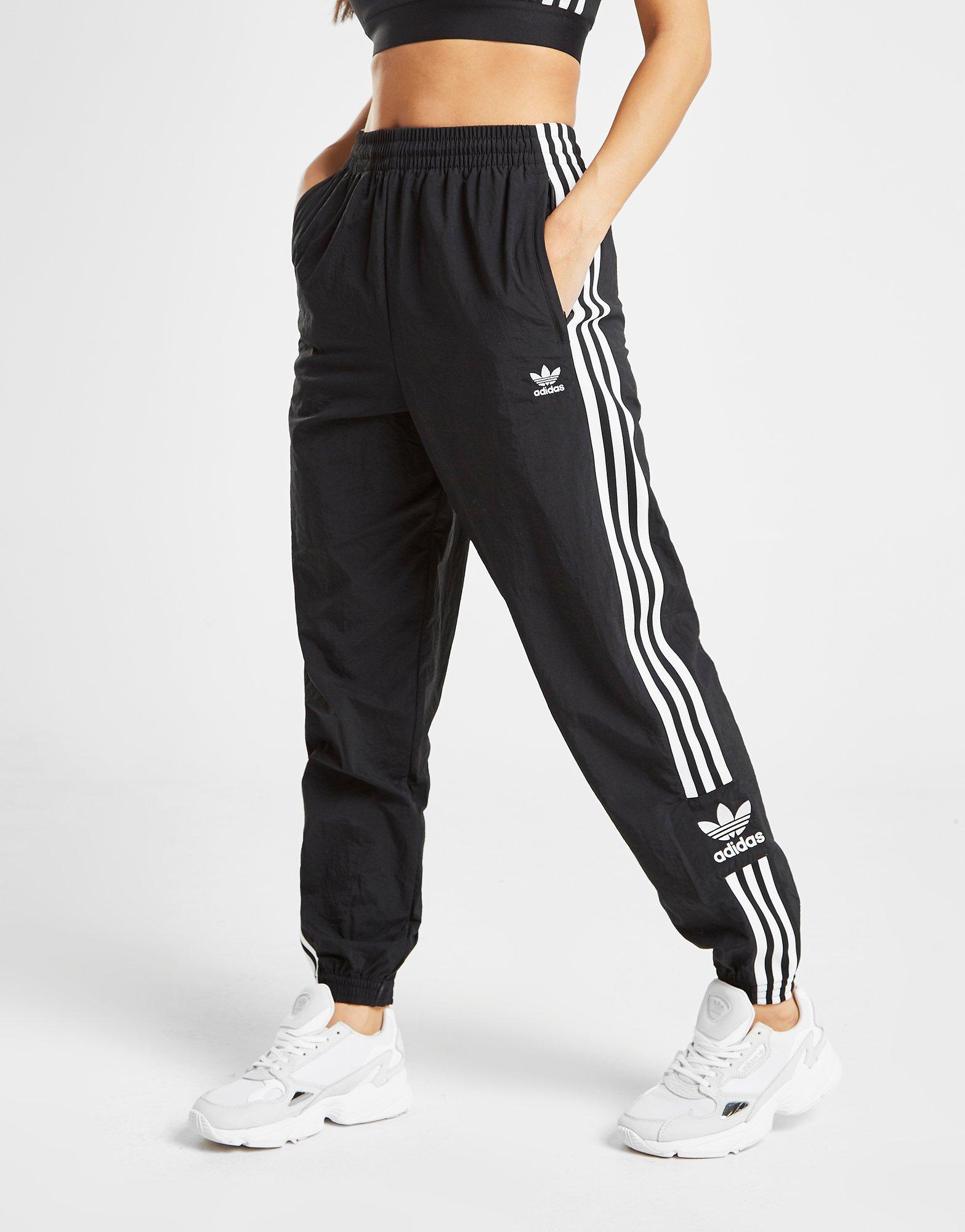 adidas original three stripe track pant with vintage logo in pink