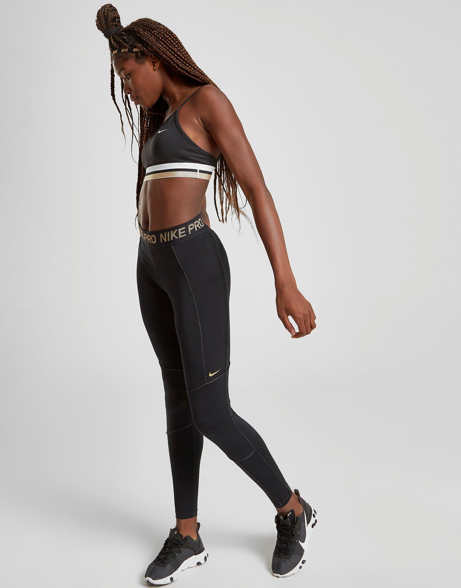 mallas nike pro dorados