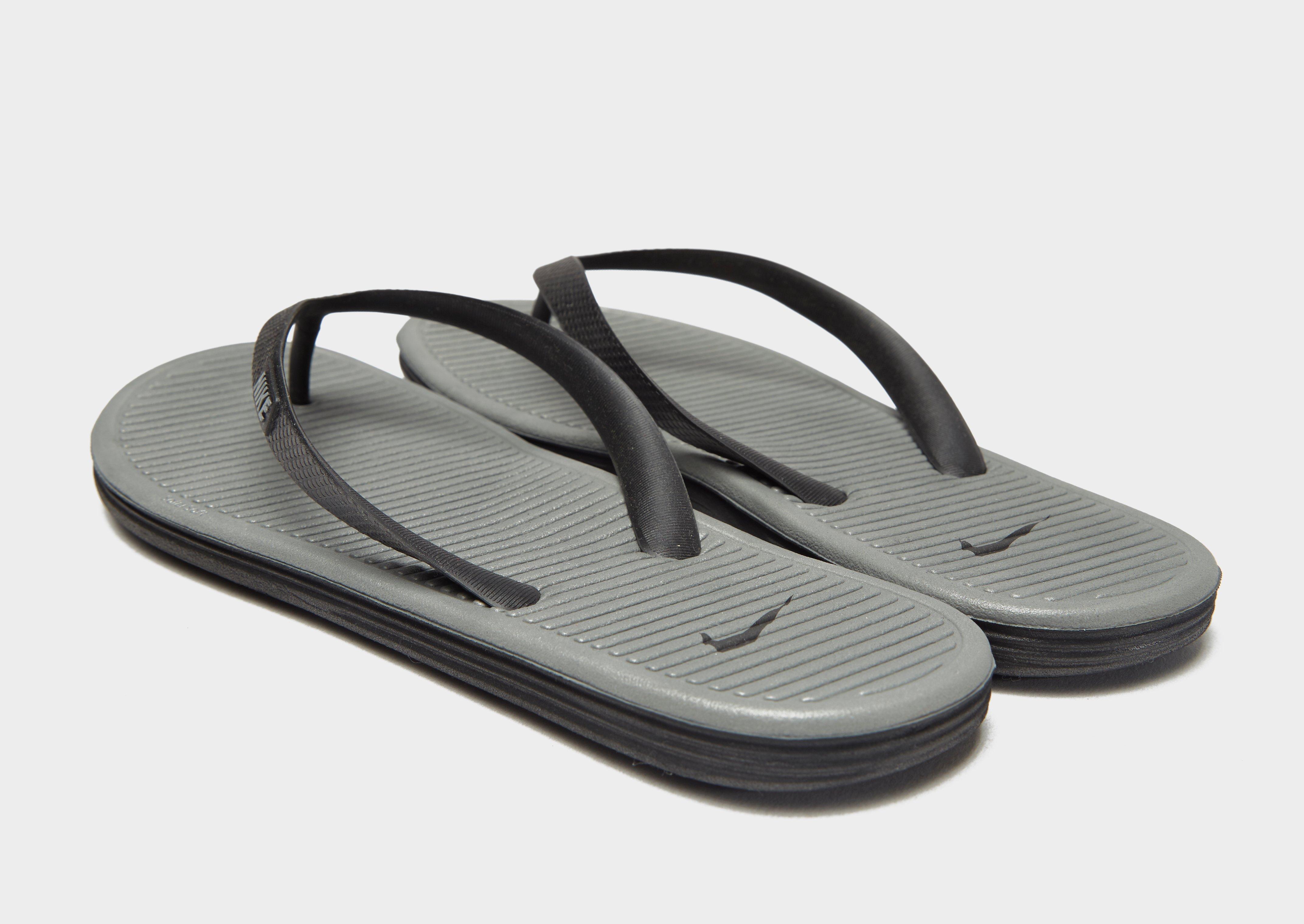 white nike solarsoft flip flops