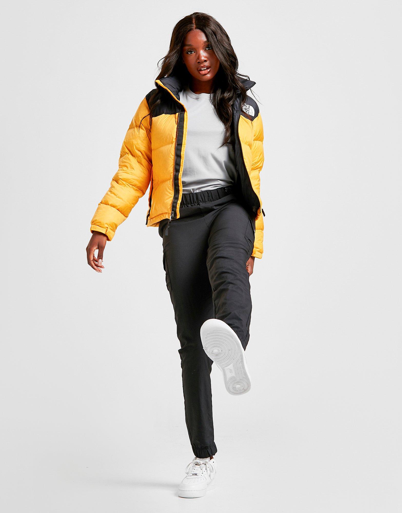 yellow north face puffer jacket