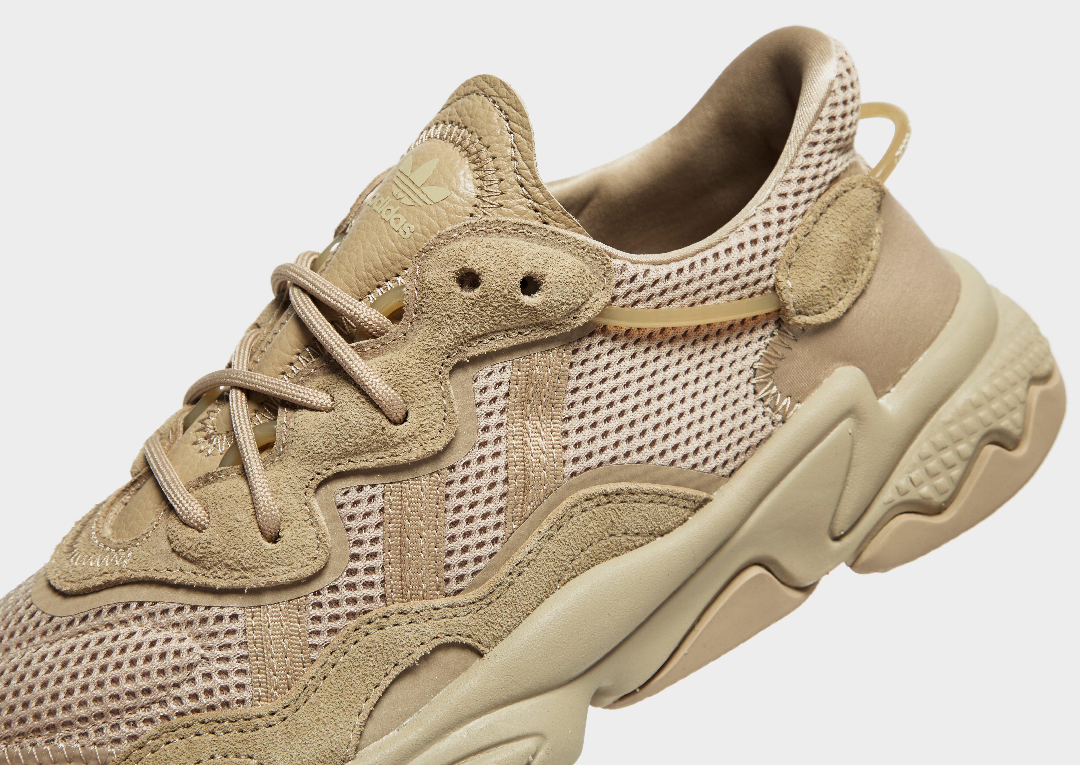 beige ozweego trainers