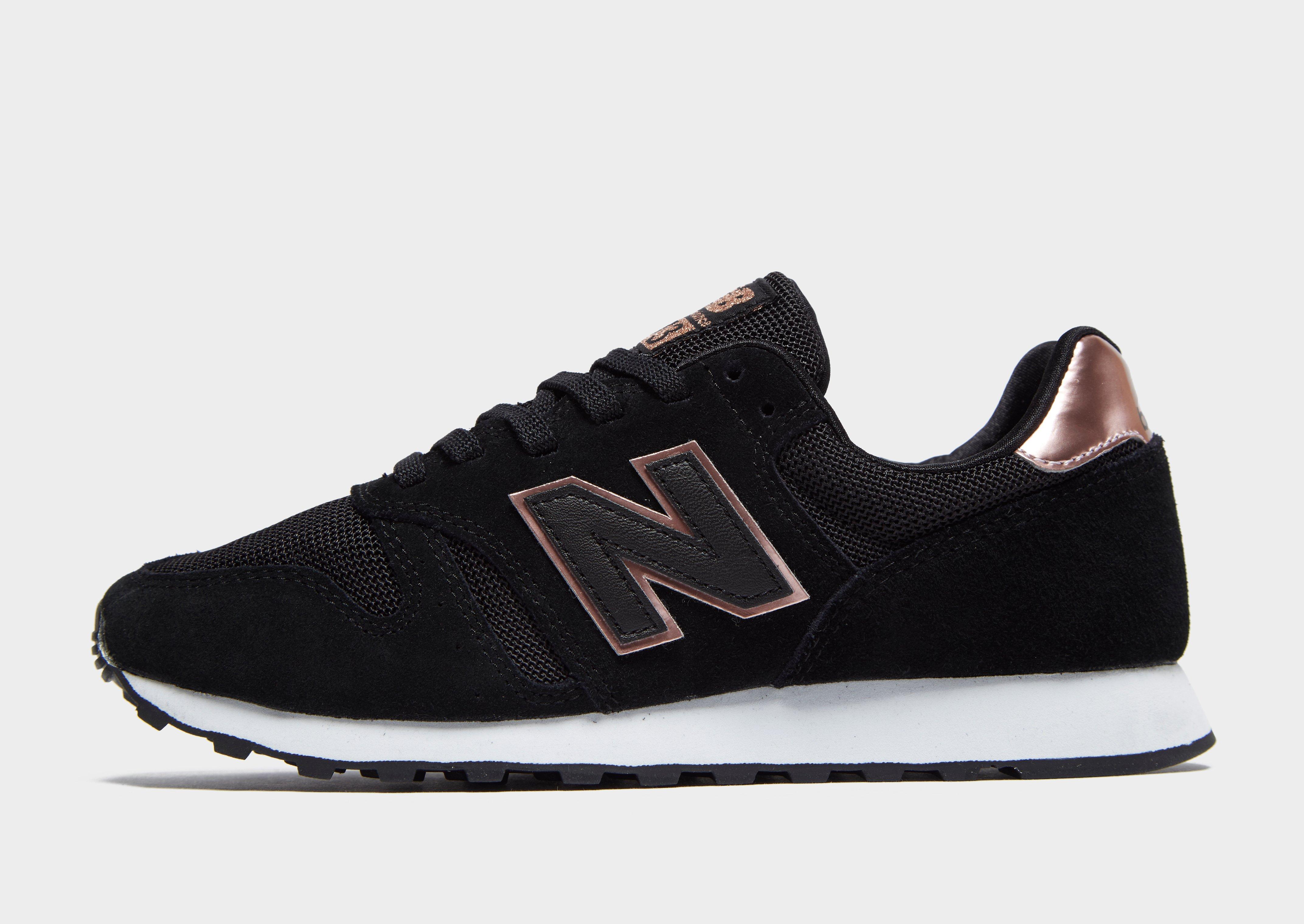 new balance 373 black and gold