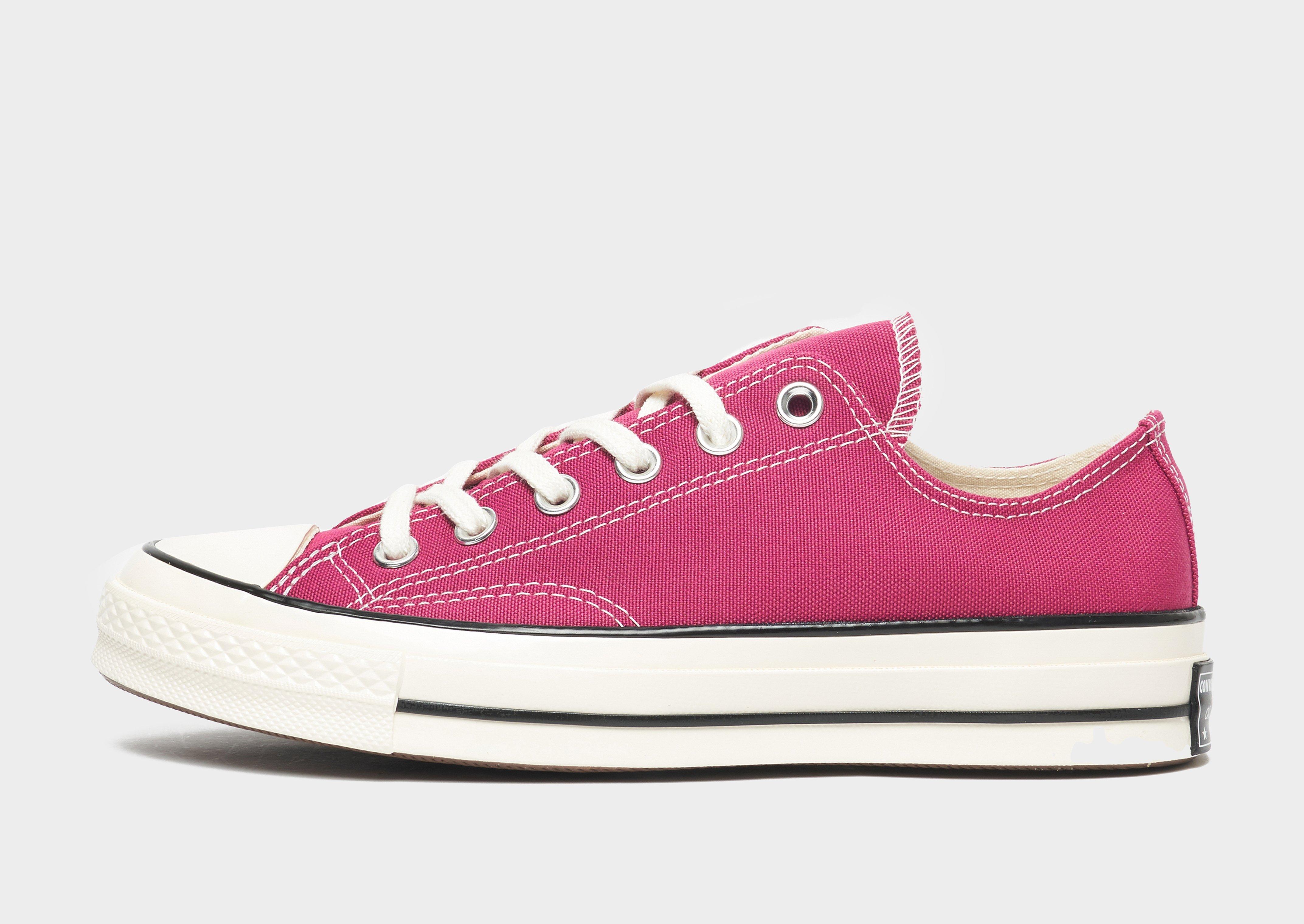 half pink half black converse