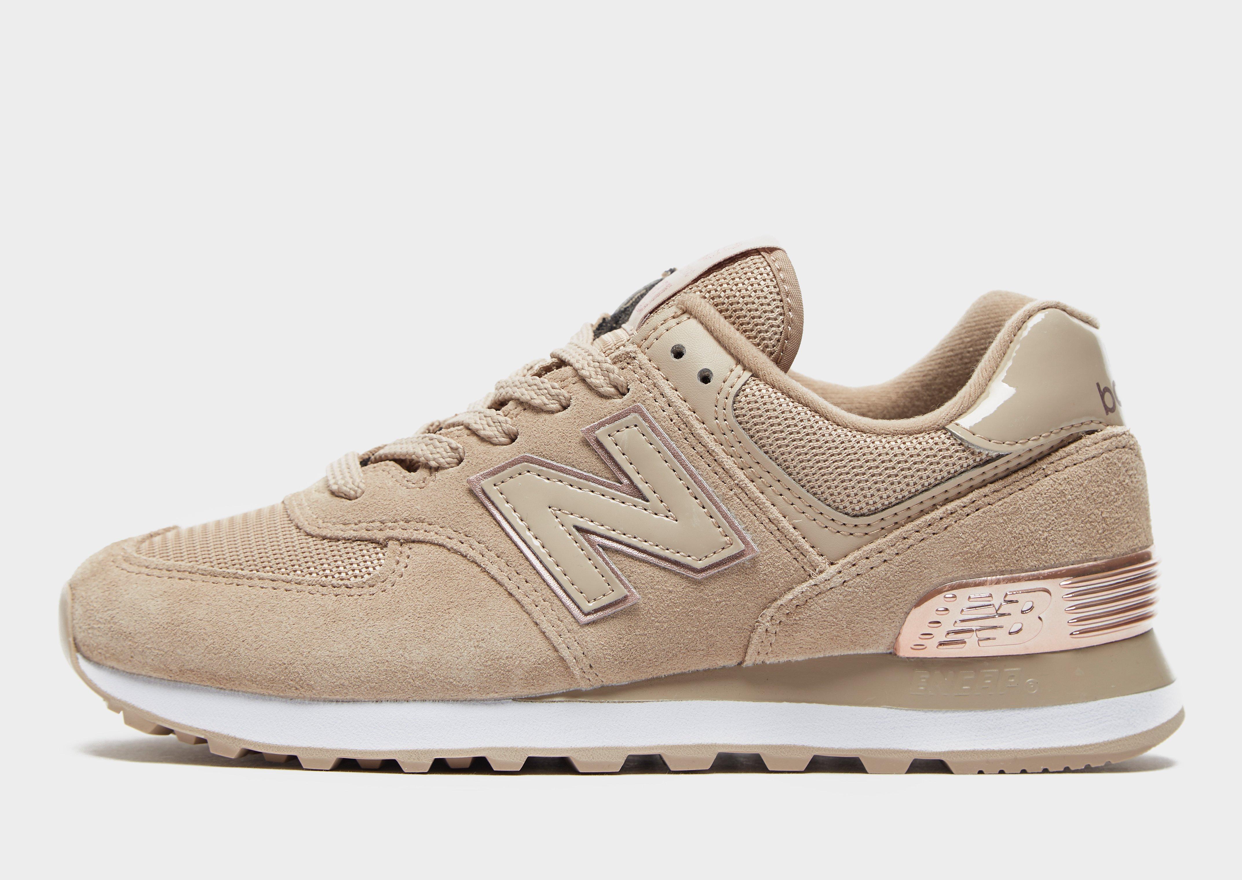 Compra New Balance 574 para mujer en Marrón