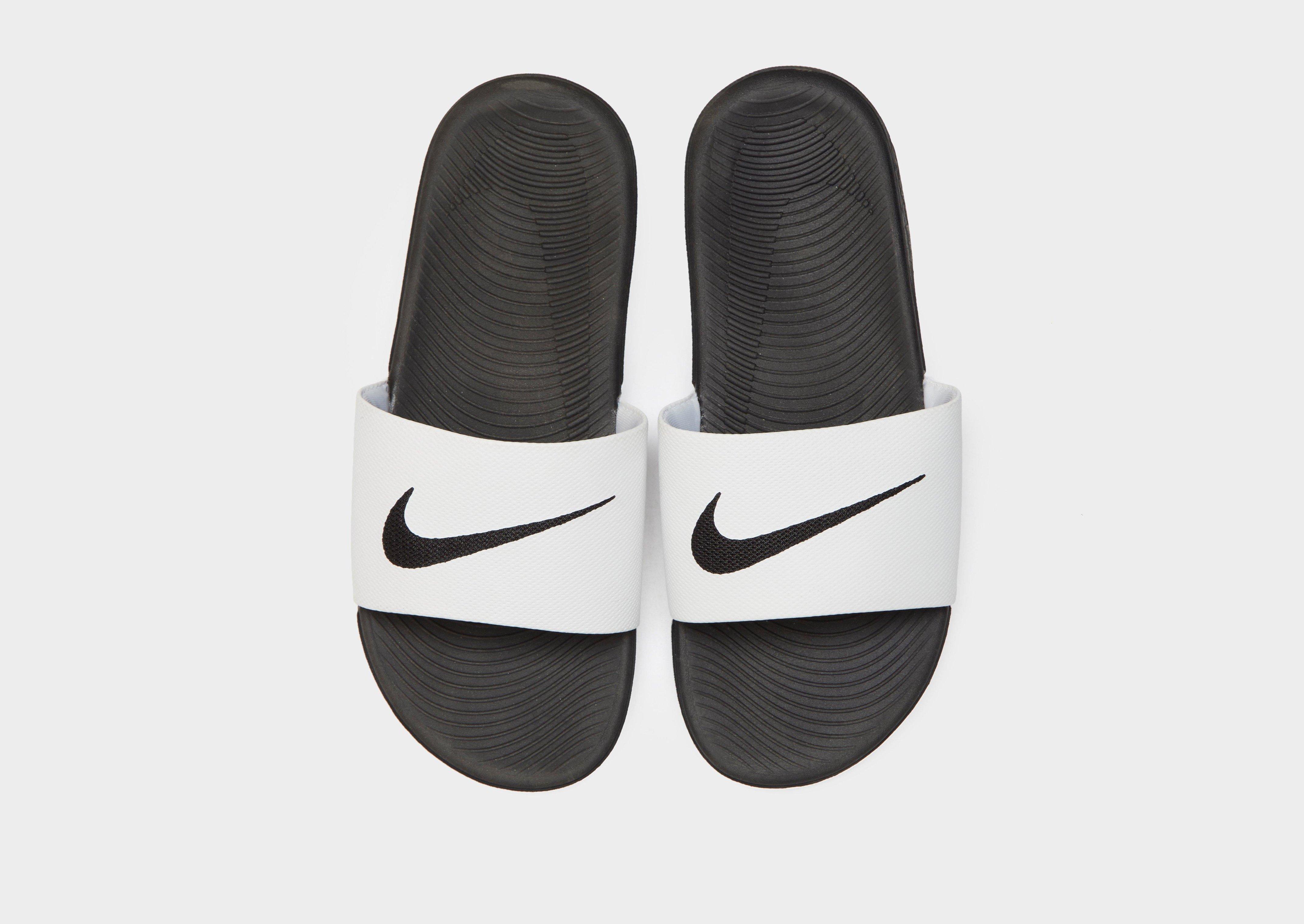 kids white nike slides