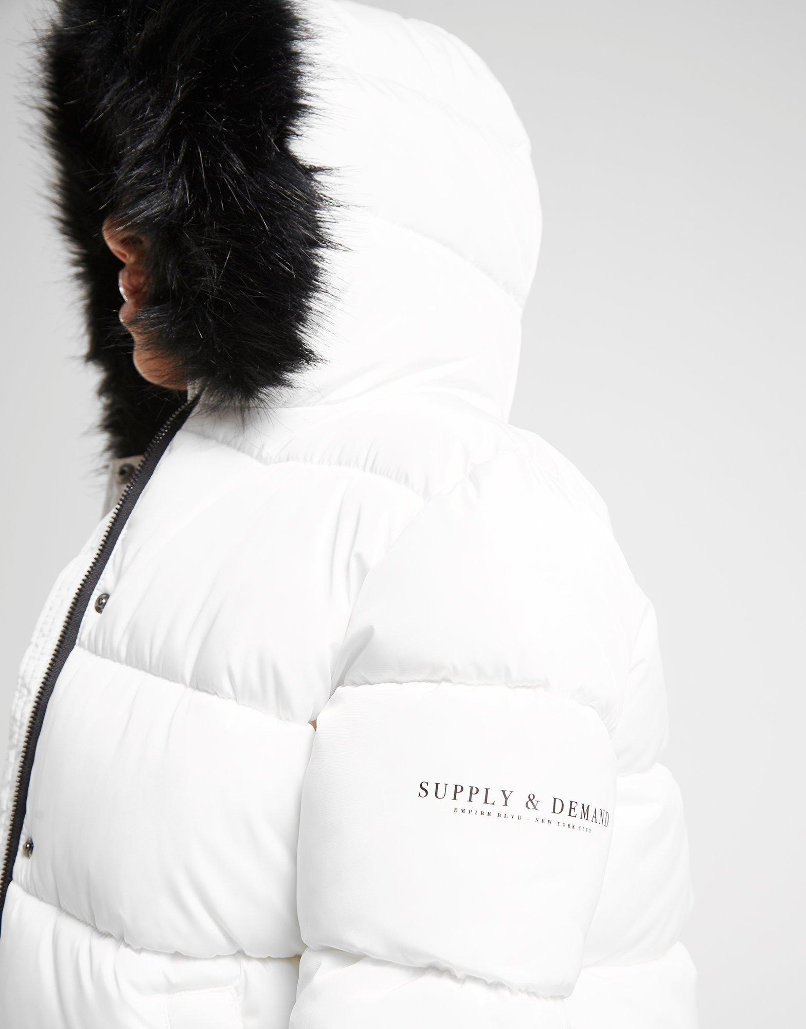 black puffer coat with white fur hood