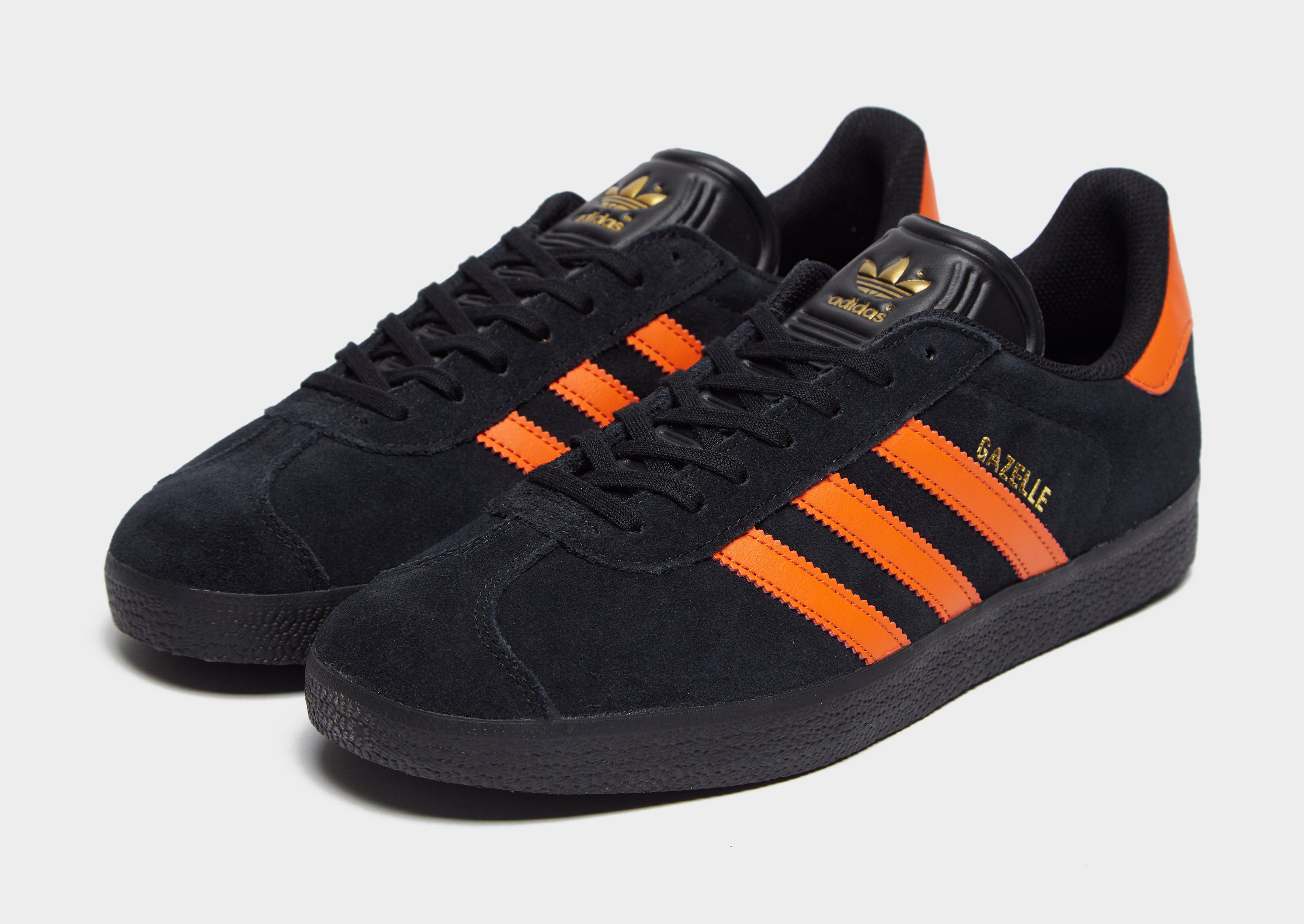 orange and black adidas gazelles