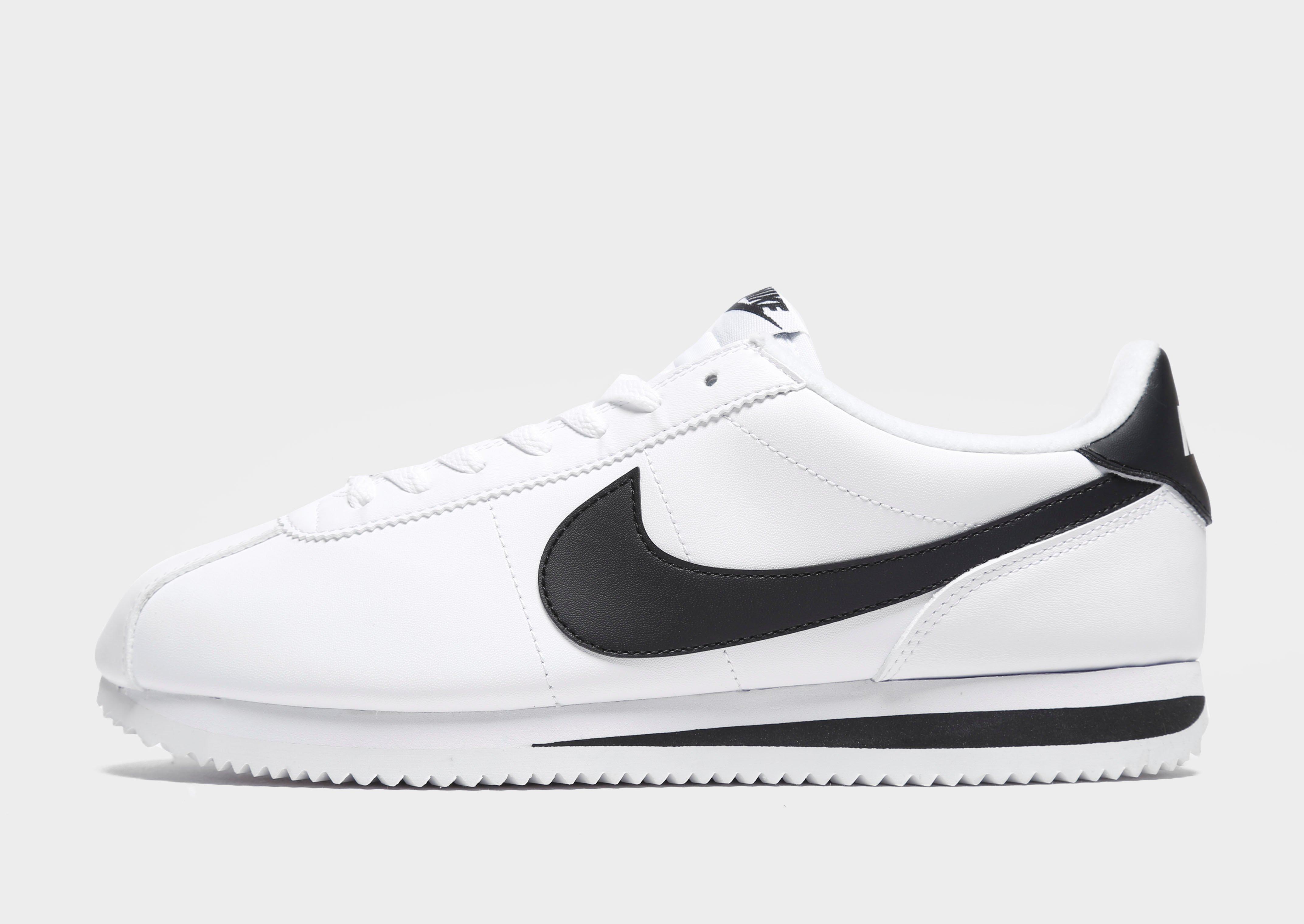 nike cortez leather trainers in white with black swoosh