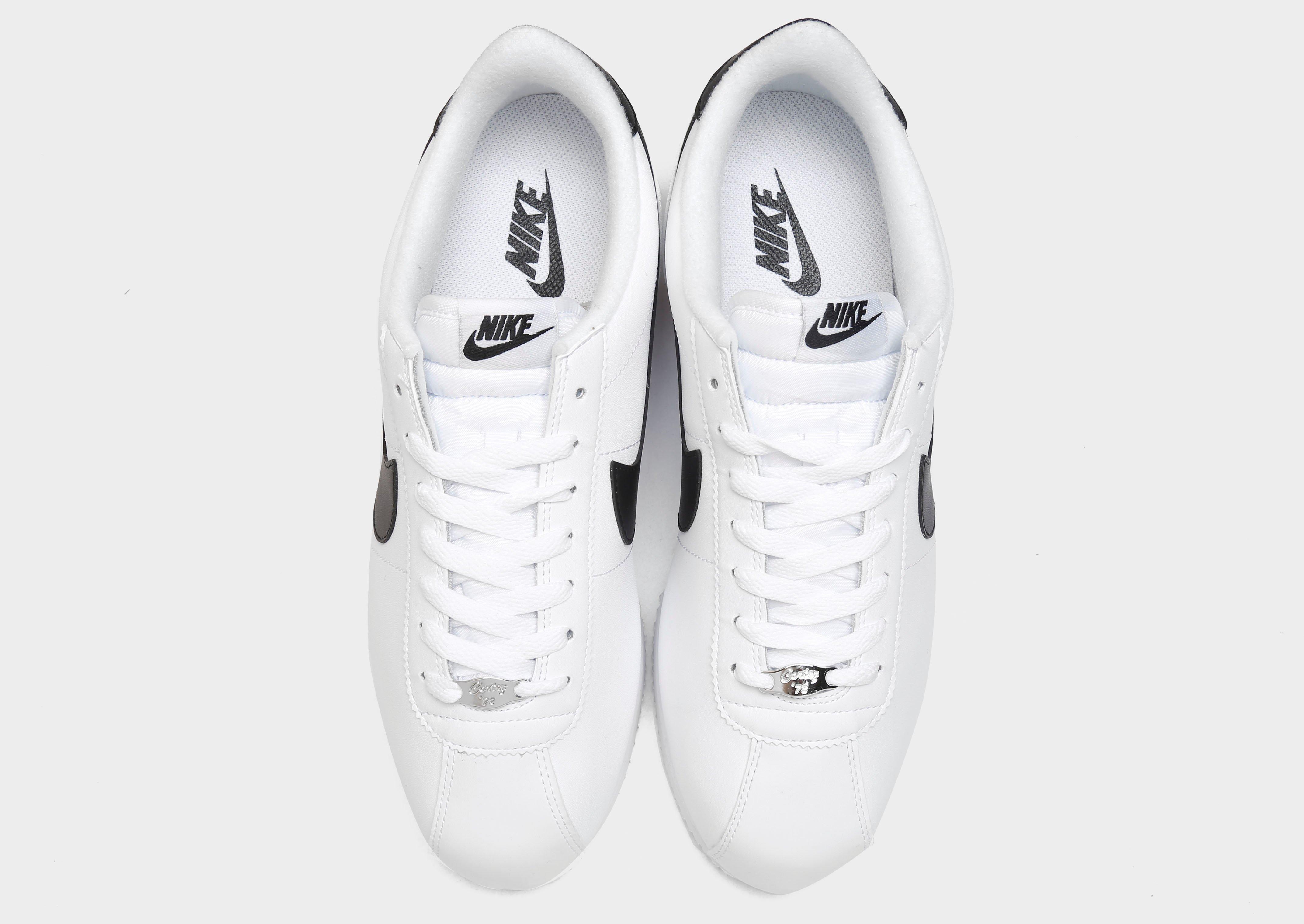 nike white and black classic cortez leather trainers