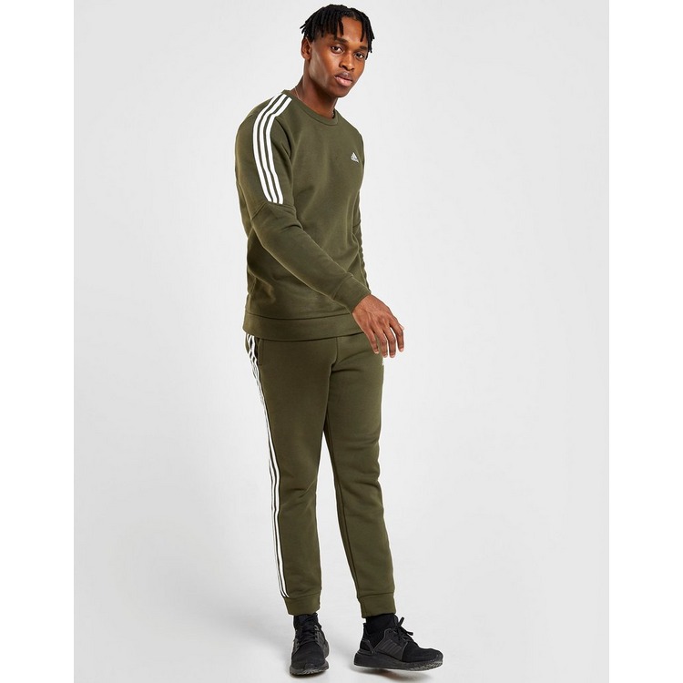 black adidas pants with green stripes